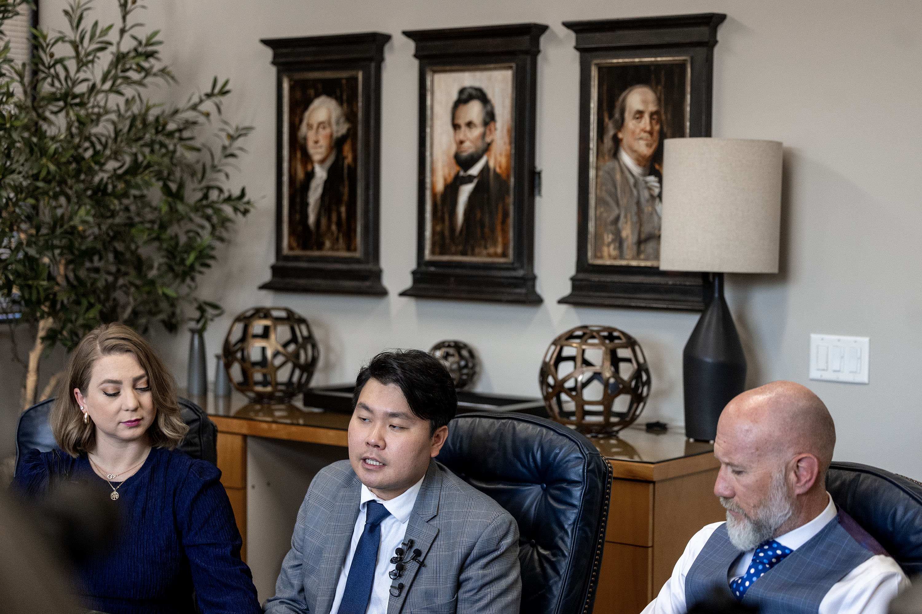 DaNae Snow, John Shin and attorney Adam Crayk speak to the media at Crayk's offices in Millcreek on Friday.