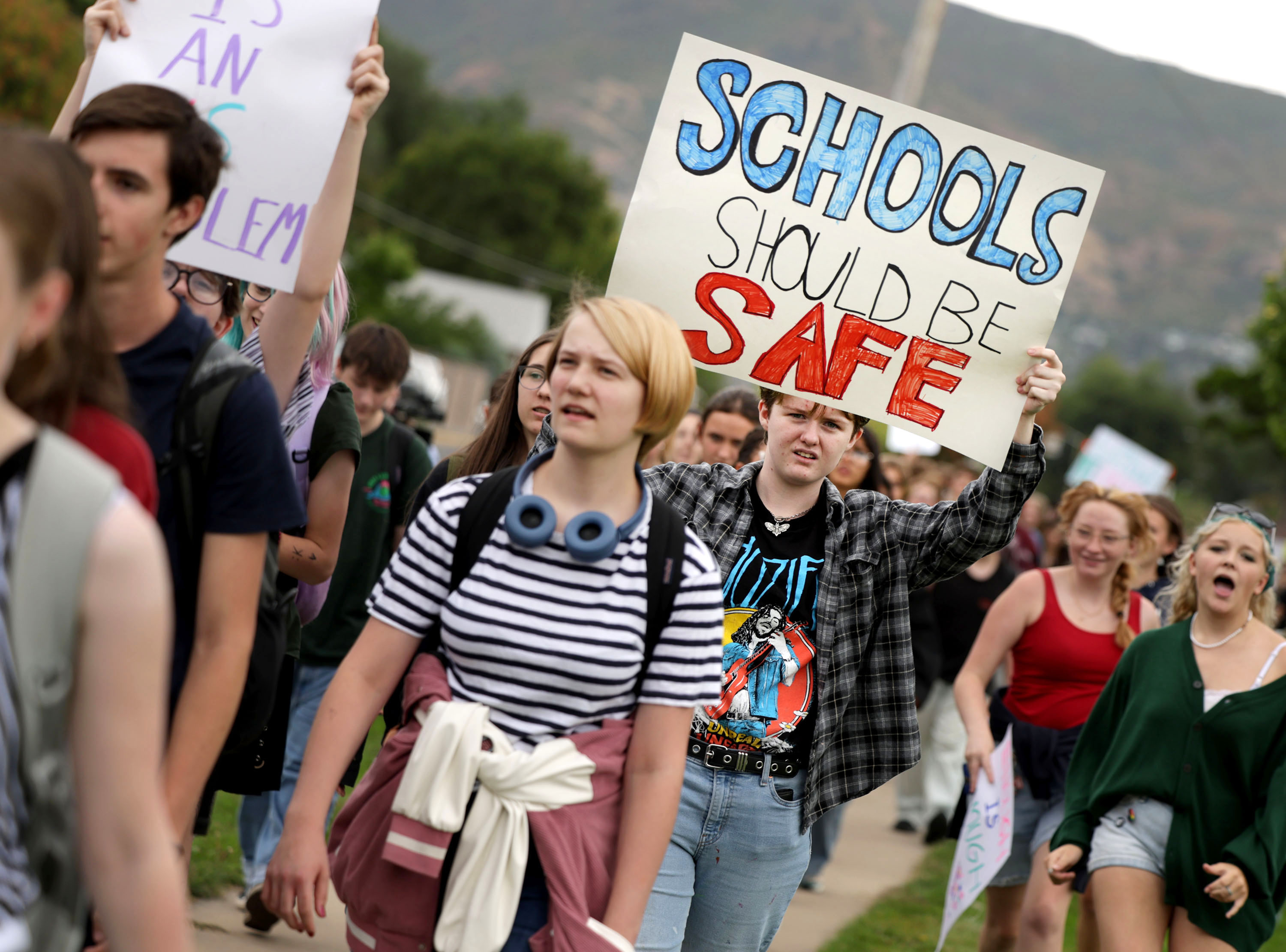 Students participate in a nationwide “walkout” to demand stronger gun laws at Highland High School in Salt Lake City on Friday.