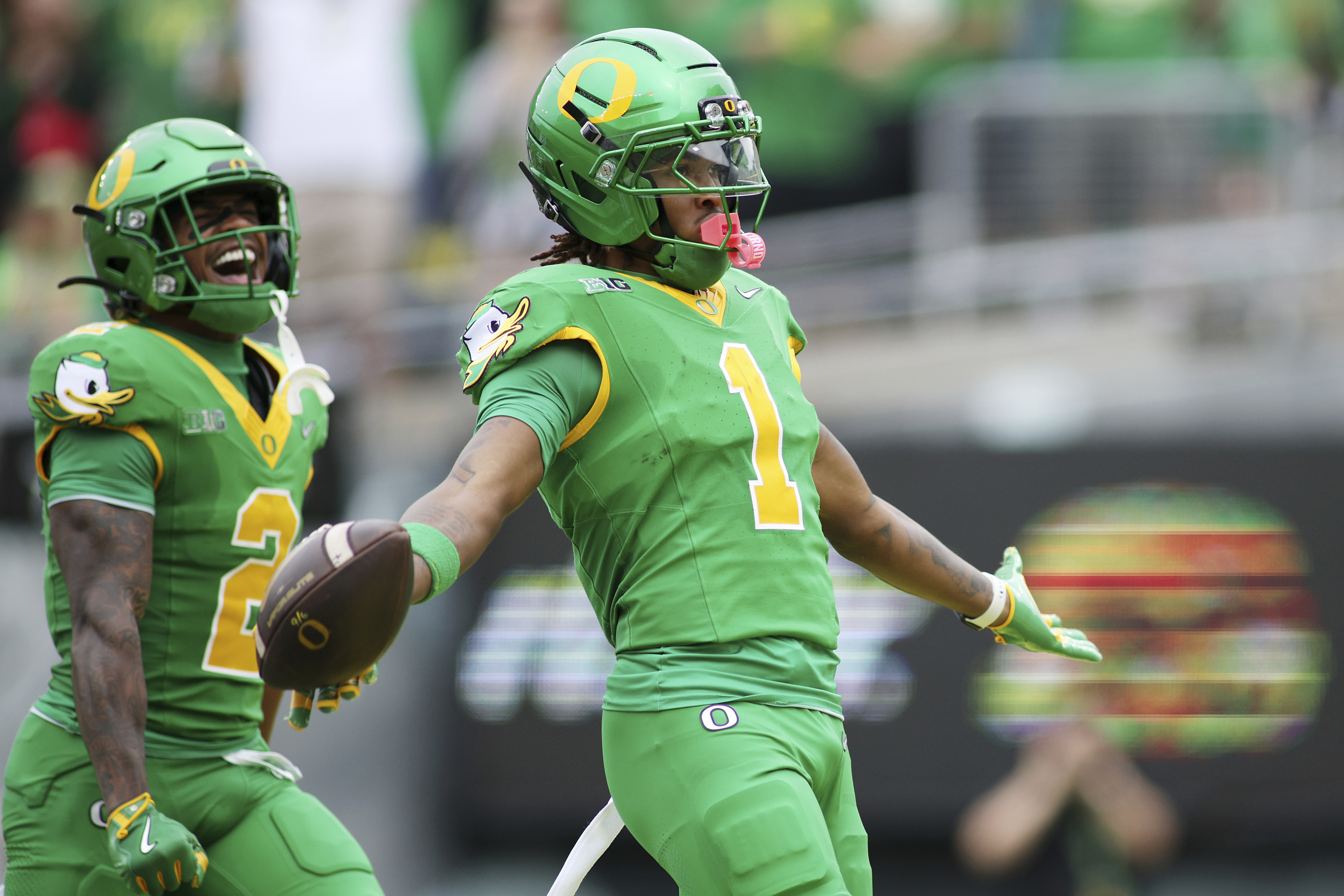 Oregon wide receiver Dakorien Moore (1) celebrates after a touchdown during the first half of an NCAA college football game against Oklahoma State, Saturday, Sept. 6, 2025, in Eugene, Ore.