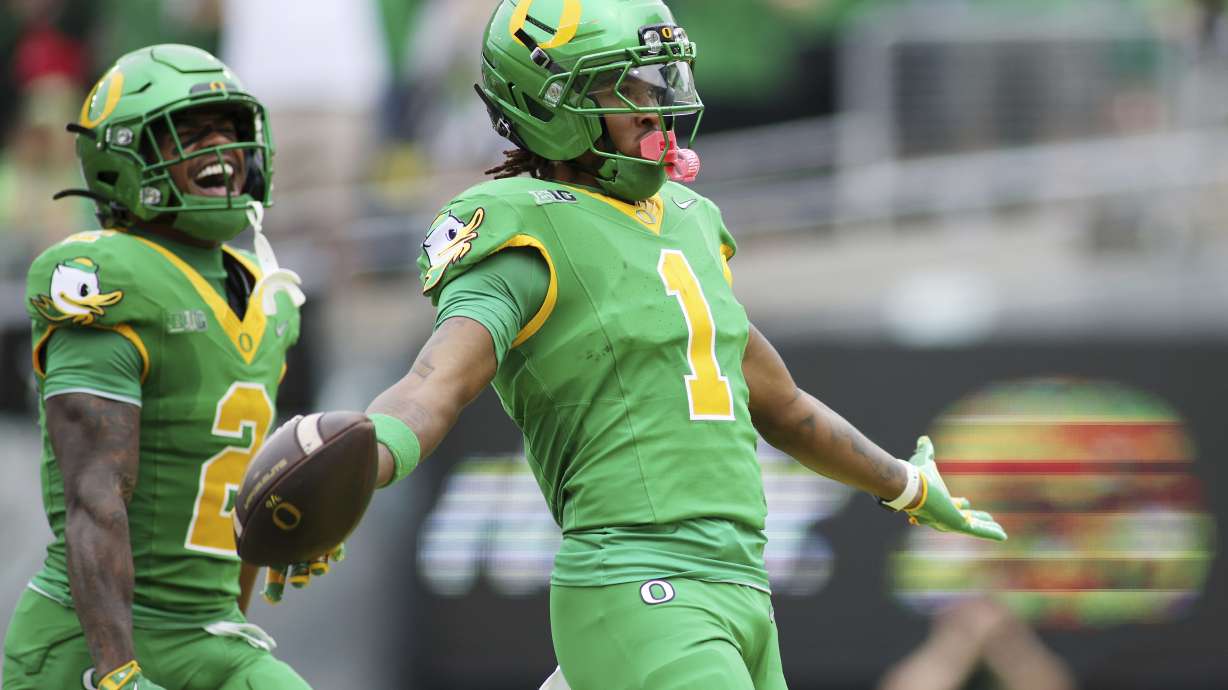 Oregon wide receiver Dakorien Moore (1) celebrates after a touchdown during the first half of an NCAA college football game against Oklahoma State, Saturday, Sept. 6, 2025, in Eugene, Ore.