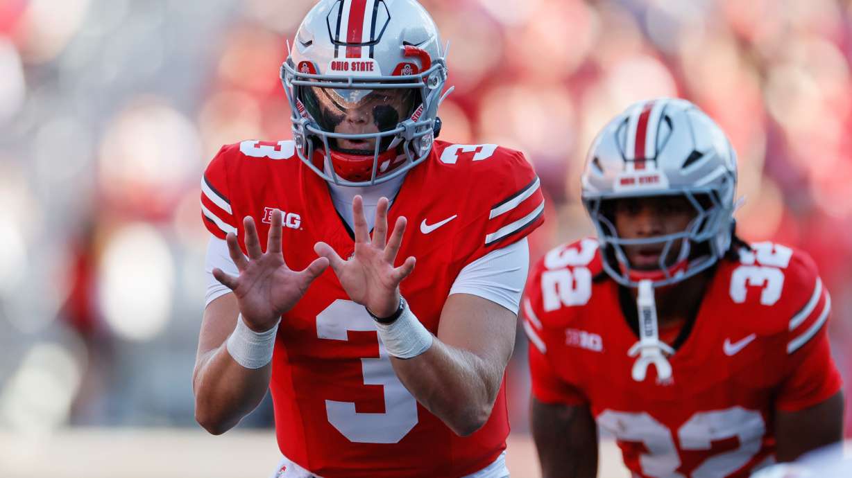 Ohio State quarterback Lincoln Kienholz takes a snap against Grambling State during the second half of an NCAA college football game, Saturday, Sept. 6, 2025, in Columbus, Ohio.