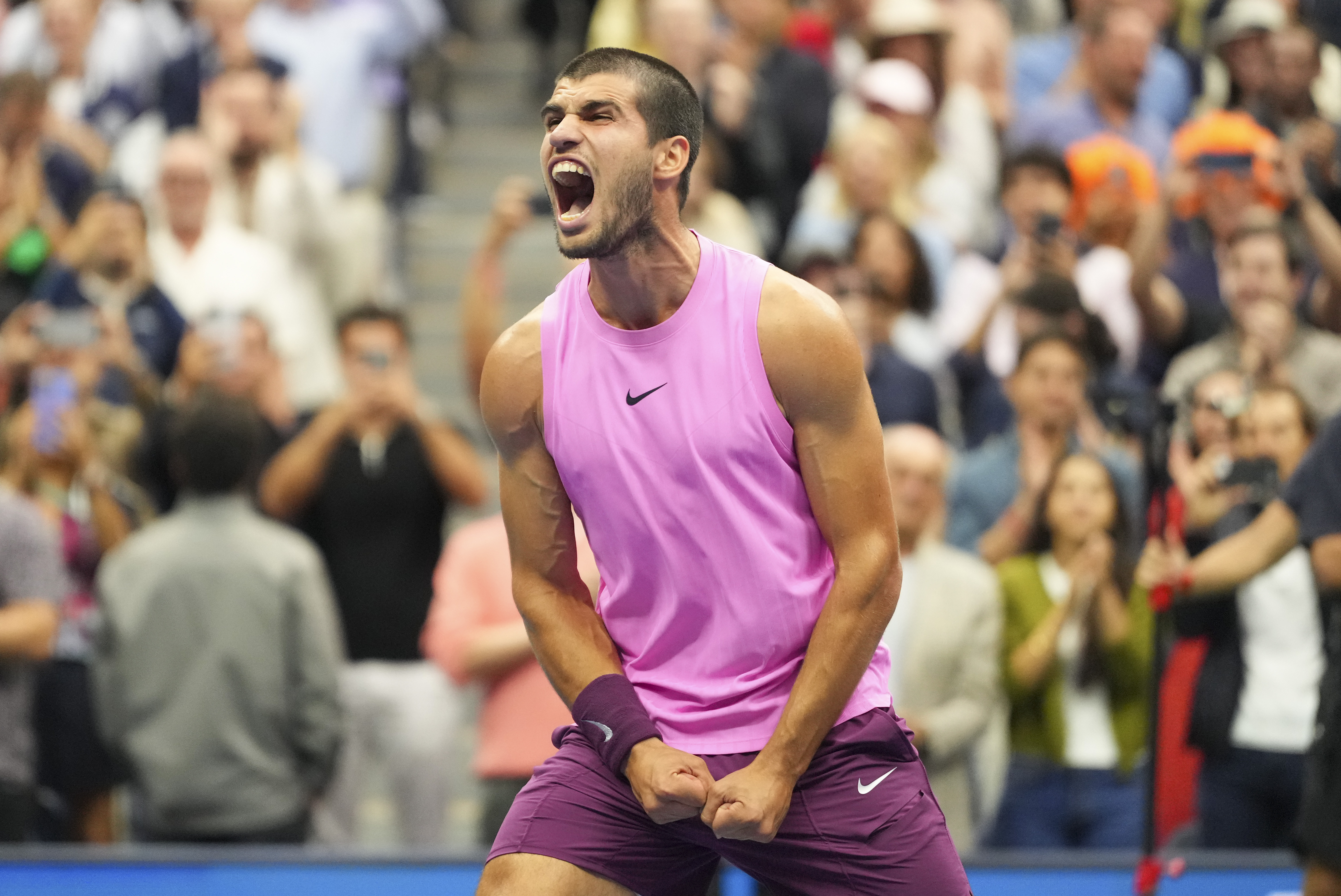 Carlos Alcaraz, of Spain, celebrates after defeating Jannik Sinner, of Italy, in the men's singles final of the U.S. Open tennis championships, Sunday, Sept. 7, 2025, in New York.