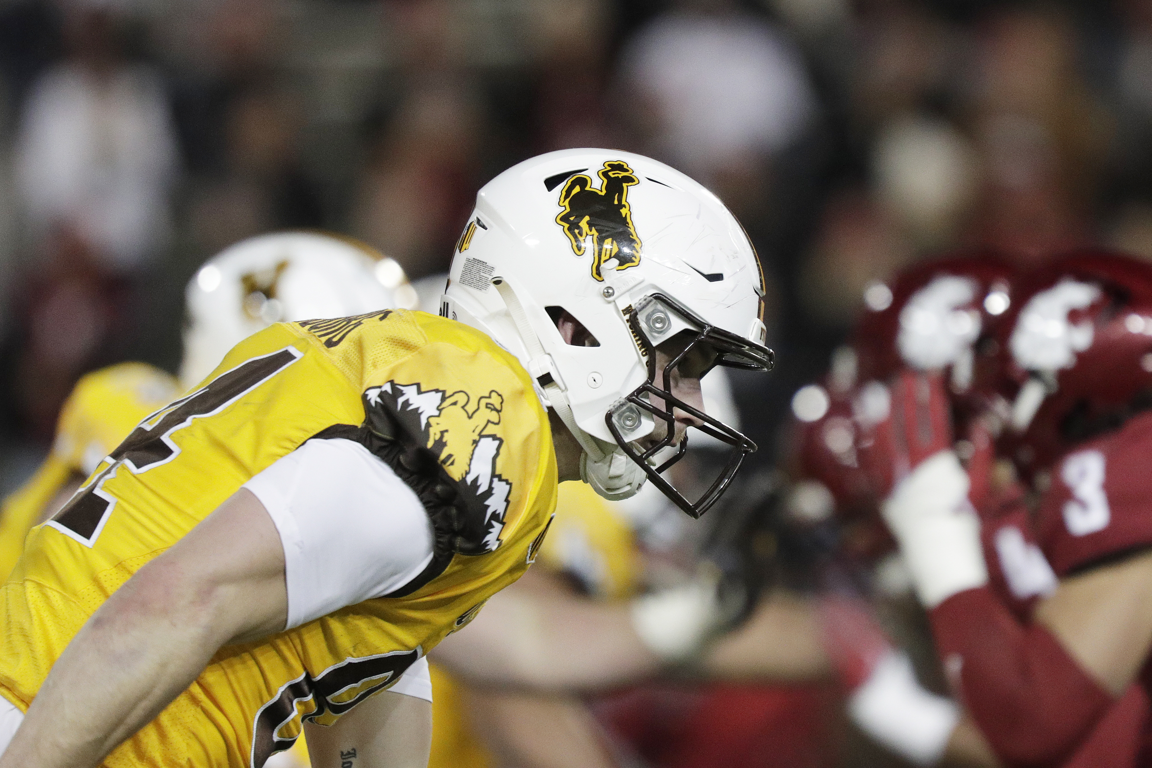 Why did Utah football agree to play a game at Wyoming?