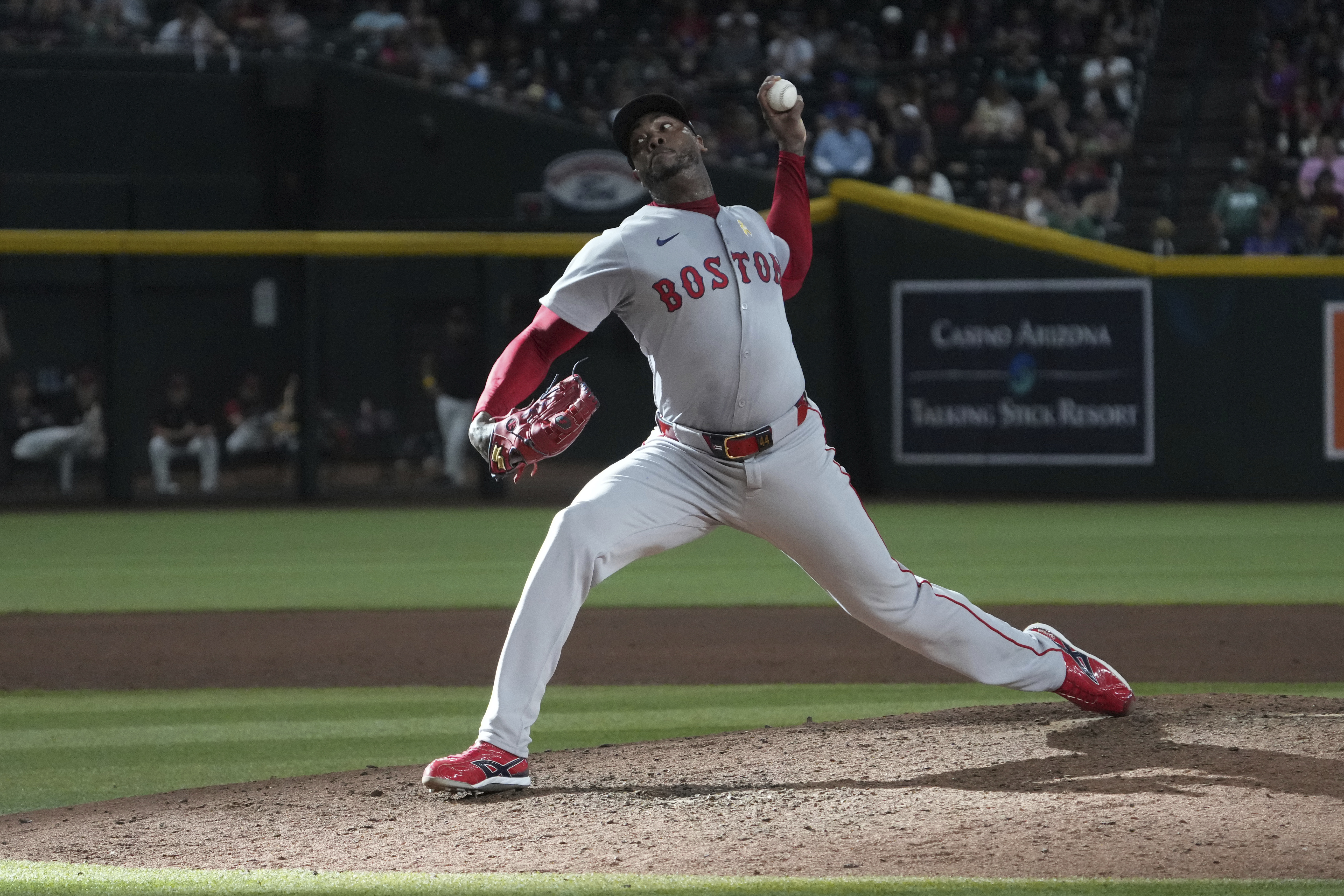 Boston Red Sox pitcher Aroldis Chapman throws against the Arizona Diamondbacks in the ninth inning during a baseball game, Sunday, Sept 7, 2025, in Phoenix. 
