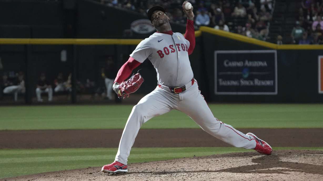 Boston Red Sox pitcher Aroldis Chapman throws against the Arizona Diamondbacks in the ninth inning during a baseball game, Sunday, Sept 7, 2025, in Phoenix.