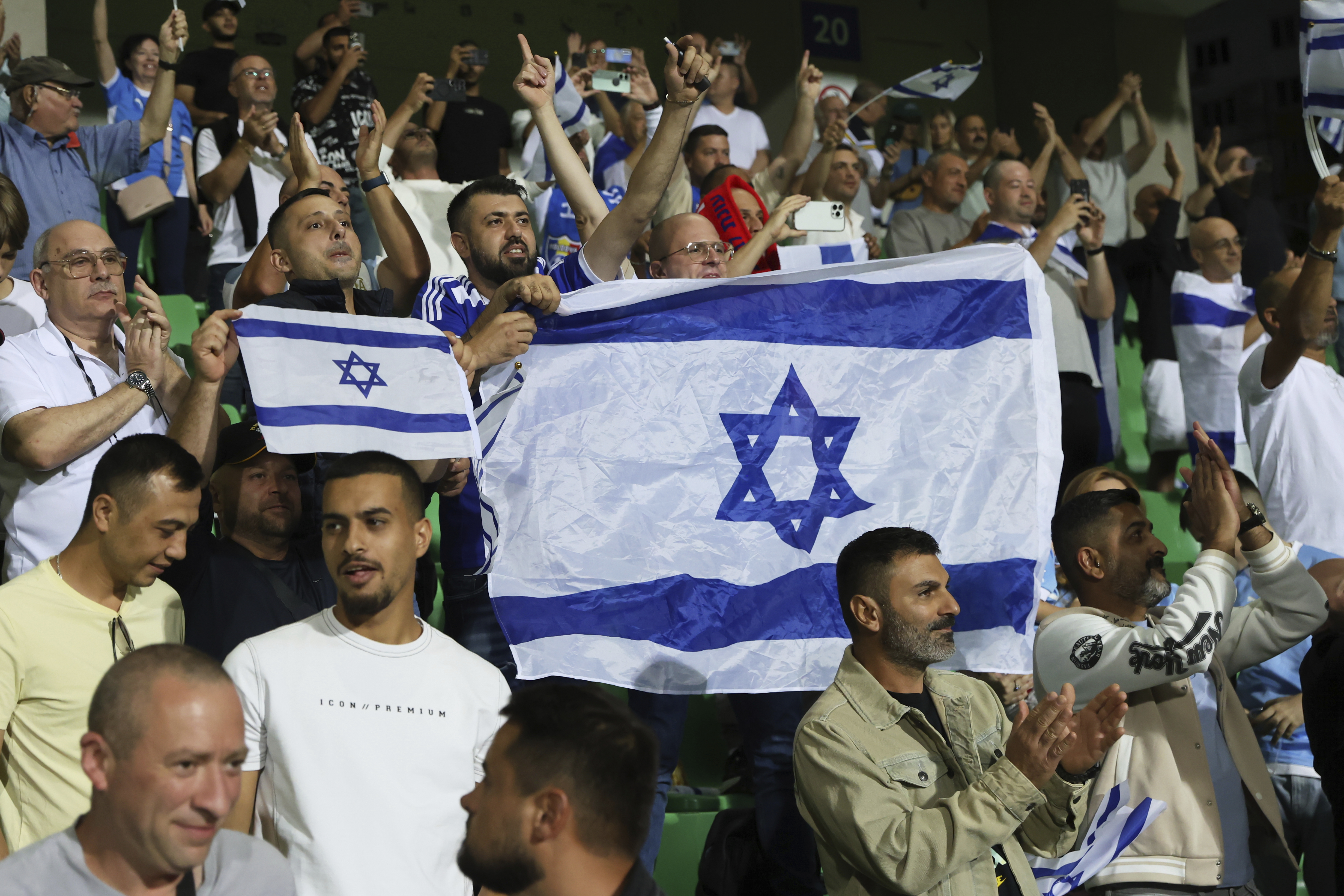 Israel's fans cheer during a group 1, World Cup qualifier soccer match between Moldova and Israel at the ZImbru stadium in Chisinau, Moldova, Friday, Sept. 5, 2025. 