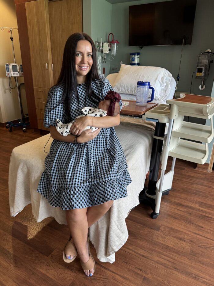 Aintzane Simpkins and her daughter, Gia, are shown in Logan. Family members cite the timing of Gia's birth for contributing to the survival of her grandfather, who was just seconds from medical help when he collapsed.