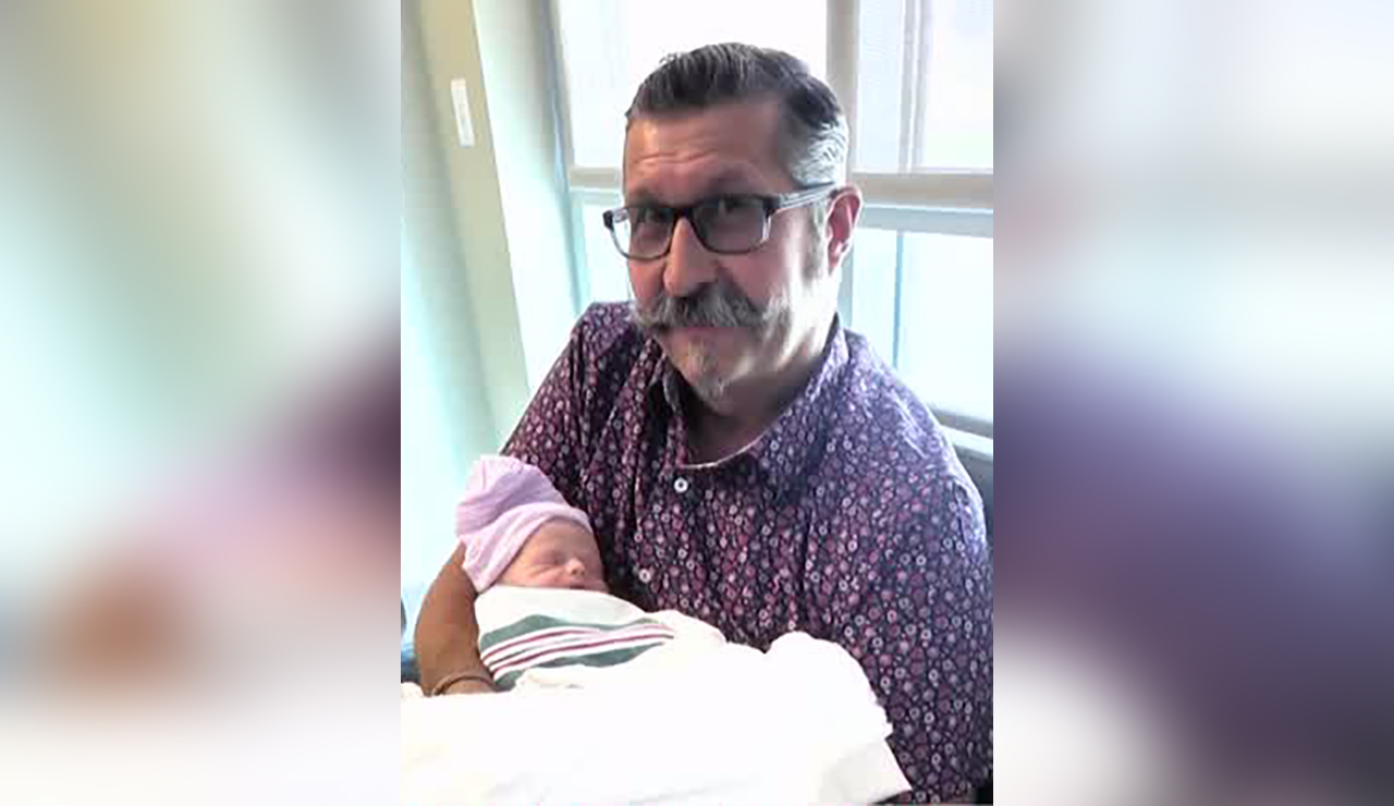 Hospital workers save new grandfather after collapse