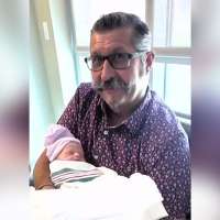 Hospital workers save new grandfather after collapse