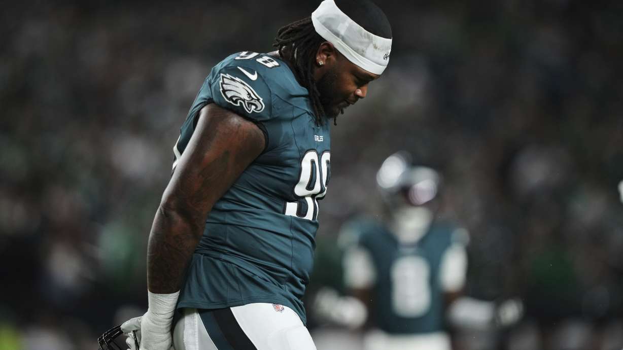 Philadelphia Eagles defensive tackle Jalen Carter walks off the field after being disqualified for unsportsman like conduct before an NFL football game against the Dallas Cowboys Thursday, Sept. 4, 2025, in Philadelphia.