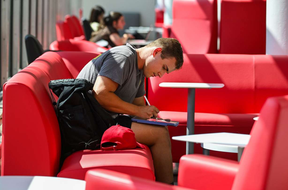 University of Utah student Ben Haws writes on his tablet while in the Student Union in Salt Lake City on Friday, Sept. 5.