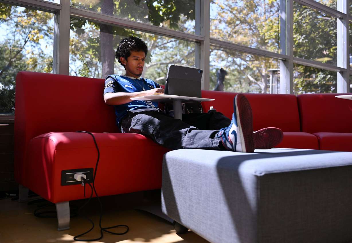 University of Utah student Augustin Cervantes works on his computer while in the Student Union in Salt Lake City on Friday, Sept. 5.