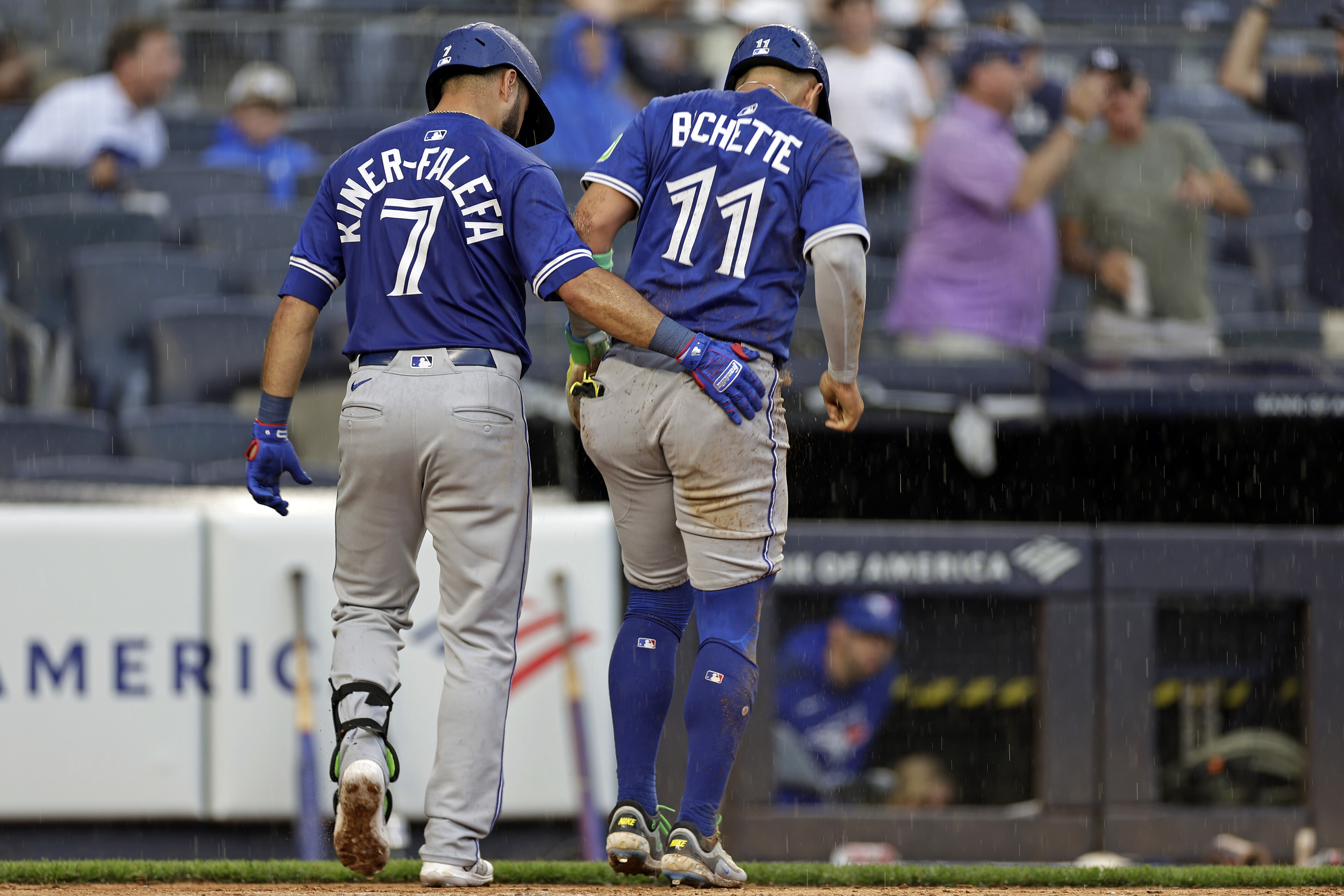 Toronto Blue Jays' Bo Bichette (11) is helped off the field by Isiah Kiner-Falefa (7) after being tagged out at home during the sixth inning of a baseball game agains the New York Yankees, Saturday, Sept. 6, 2025, in New York. 
