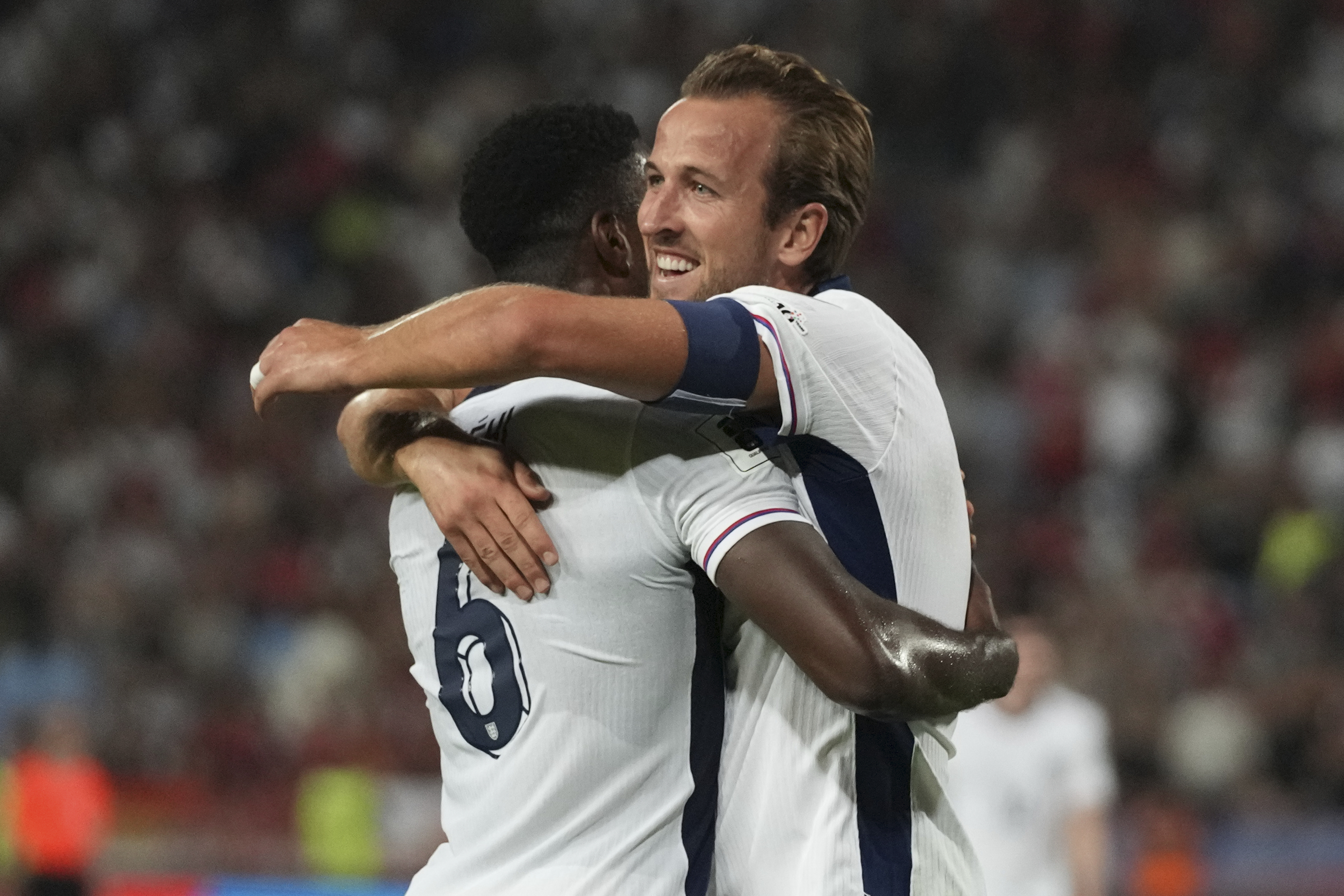 England's Marc Guehi, left, celebrates with England's Harry Kane after scoring his side's fourth goal during the World Cup Group K qualifying soccer match between Serbia and England, at the Rajko Mitic Stadium in Belgrade, Serbia, Tuesday, Sept. 9, 2025.