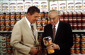 Gordon B. Hinckley, then a counselor in the First Presidency of The Church of Jesus Christ of Latter-day Saints, shows a Deseret label to President Ronald Reagan at the Ogden cannery in 1982.