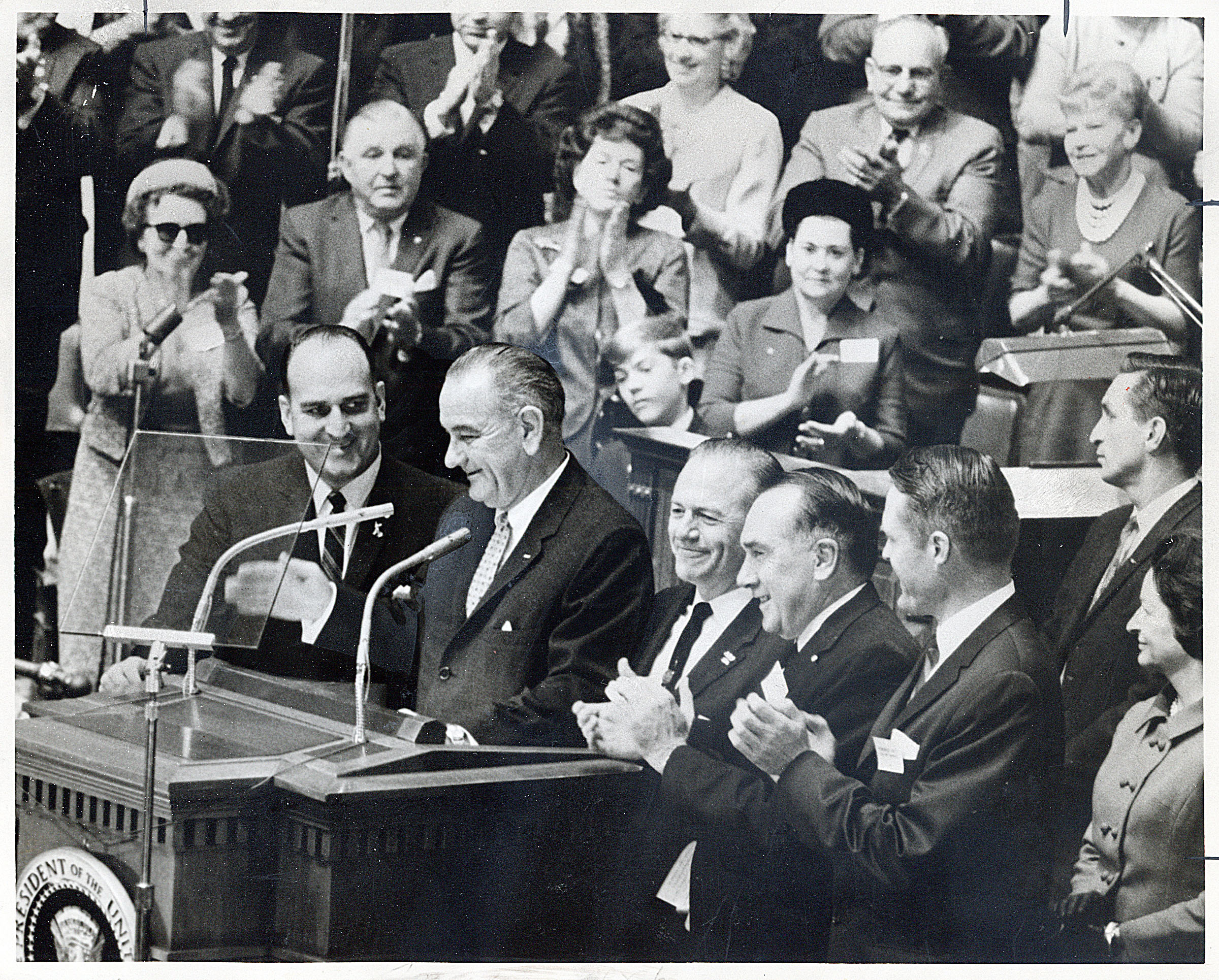 Applause greets President Lyndon B. Johnson as he is introduced at the Tabernacle on Temple Square, Oct. 29, 1964. Flanking him are William G. Bruhn, left; Sen. Frank E. Moss, Calvin Rampton, David S. King and Mrs. Johnson.