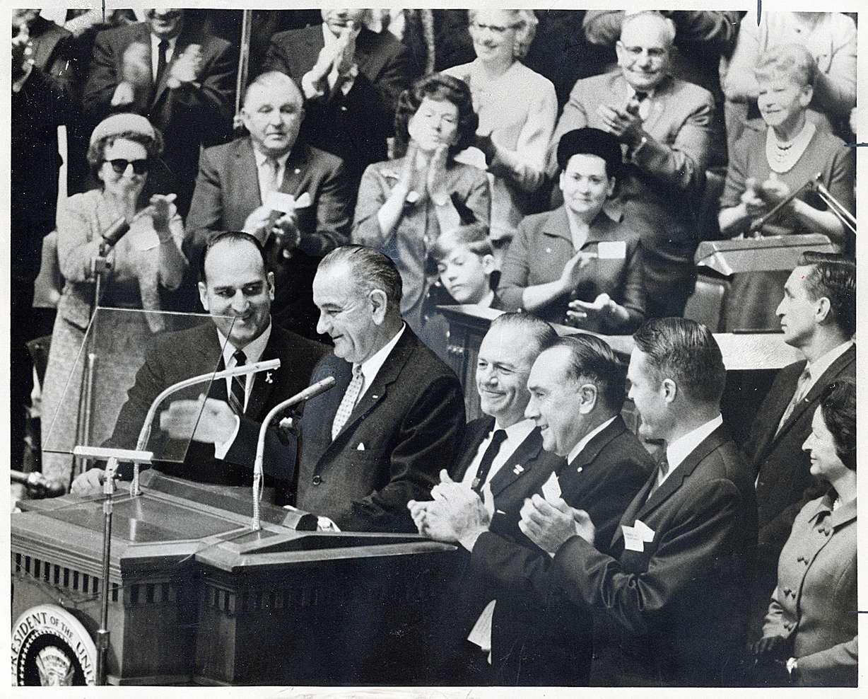 Applause greets President Lyndon B. Johnson as he is introduced at the Tabernacle on Temple Square, Oct. 29, 1964. Flanking him are William G. Bruhn, left; Sen. Frank E. Moss, Calvin Rampton, David S. King and Mrs. Johnson.