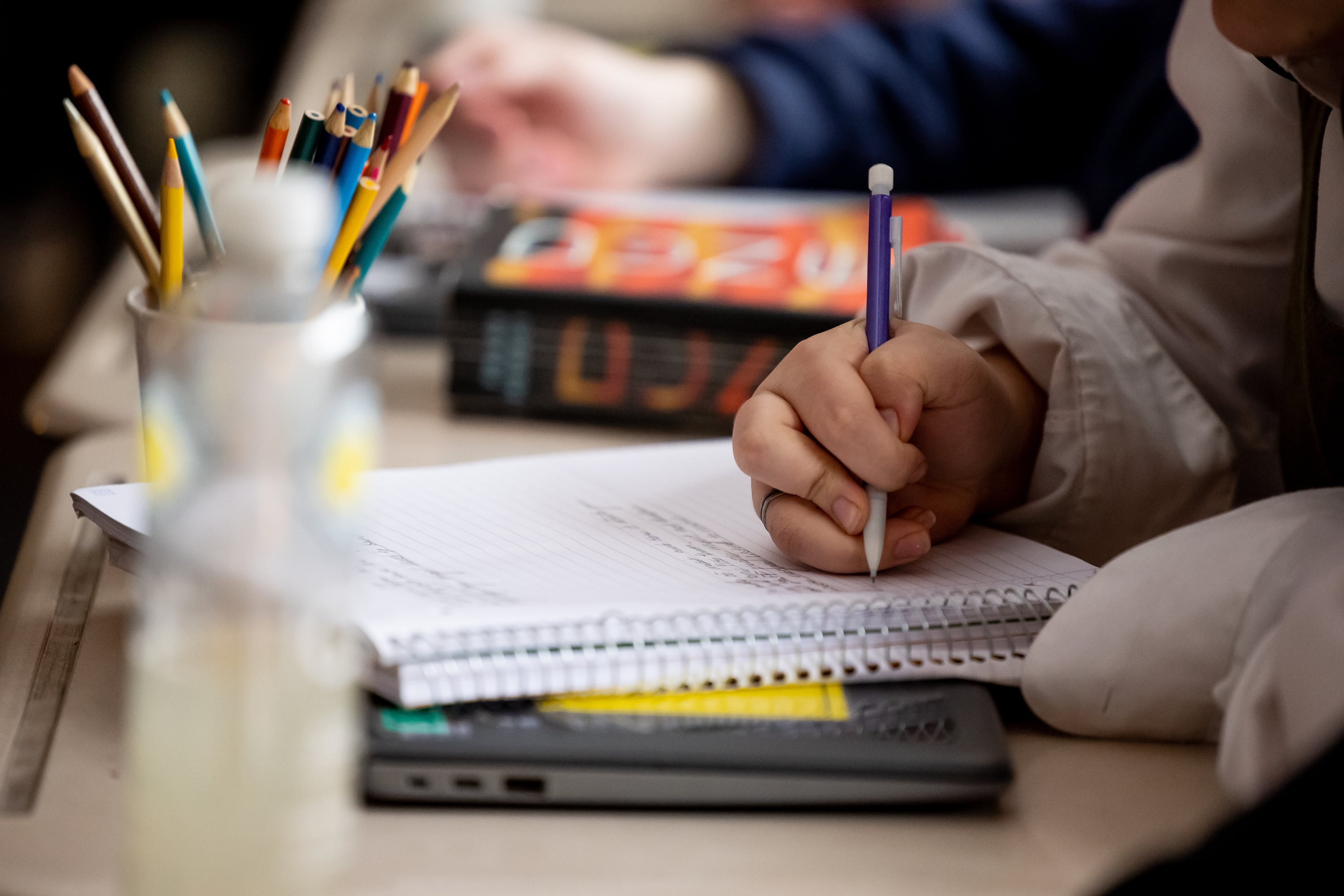 A student takes notes at Cyprus High School in Magna on Jan. 27, 2023. The National Assessment of Education Progress on Tuesday reported declining scores for eighth graders in science and 12th graders in math and reading nationwide.