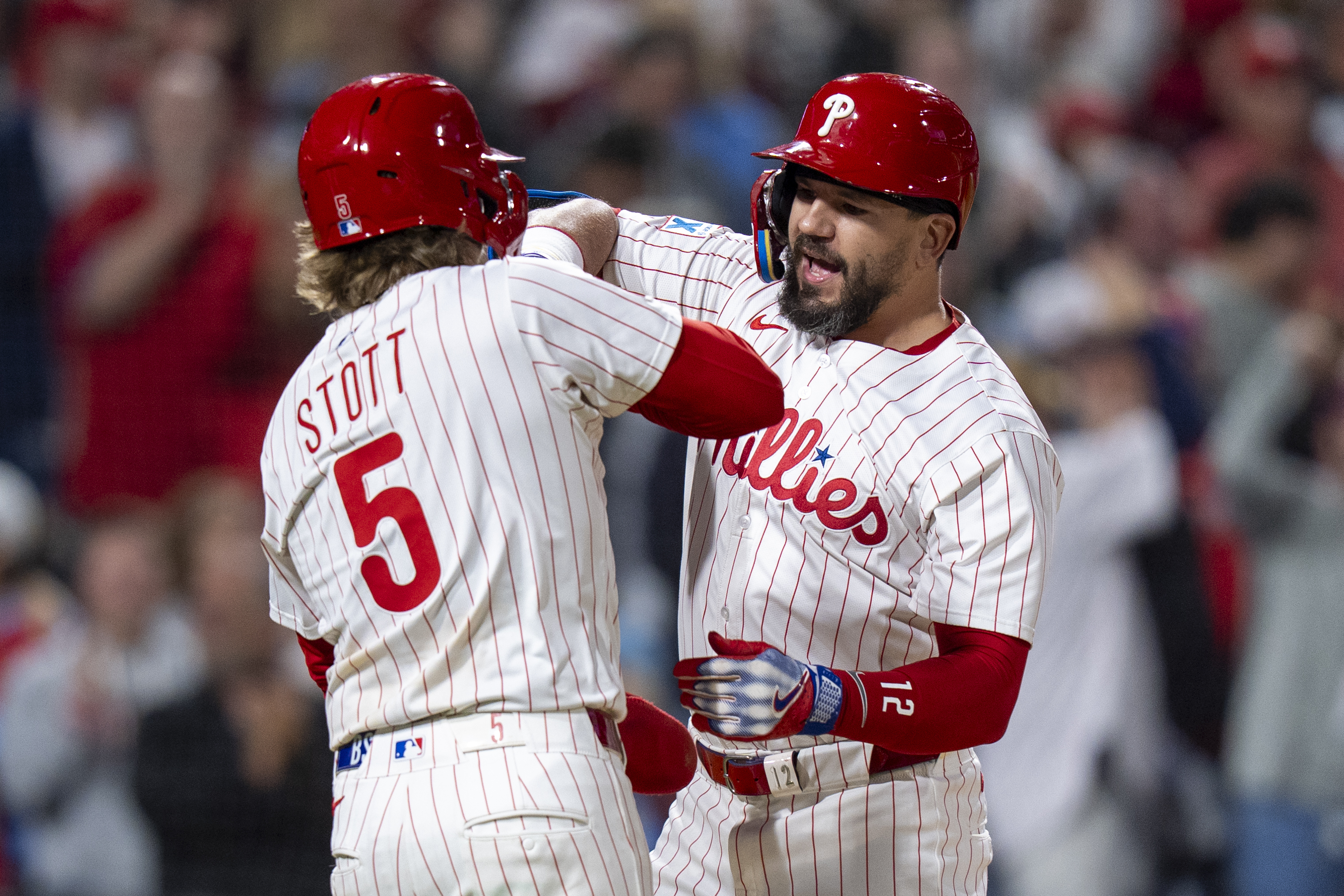 Philadelphia Phillies' Kyle Schwarber, right, reacts to his three-run home run with Bryson Stott, left, during the seventh inning of a baseball game against the New York Mets, Tuesday, Sep. 9, 2025, in Philadelphia. 