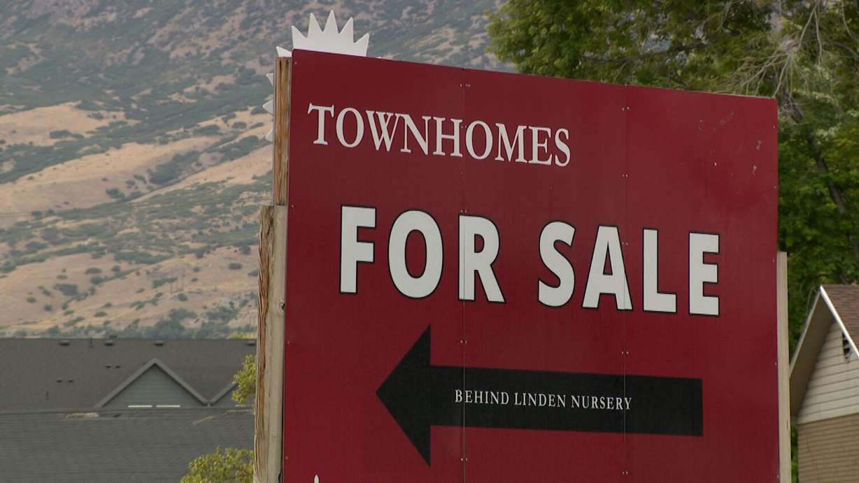 A sign advertising townhomes for sale in Lindon. Eskic said unless "something horrible" happens with the economy, home prices will remain high.