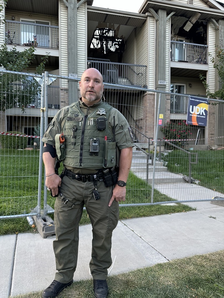 Utah County Sheriff's Sgt. Nicholas Friedrichsen is pictured Tuesday at the apartment complex damaged by fire in Eagle Mountain on Aug. 26. His body camera shows deputies risking their lives to alert residents to the fire.