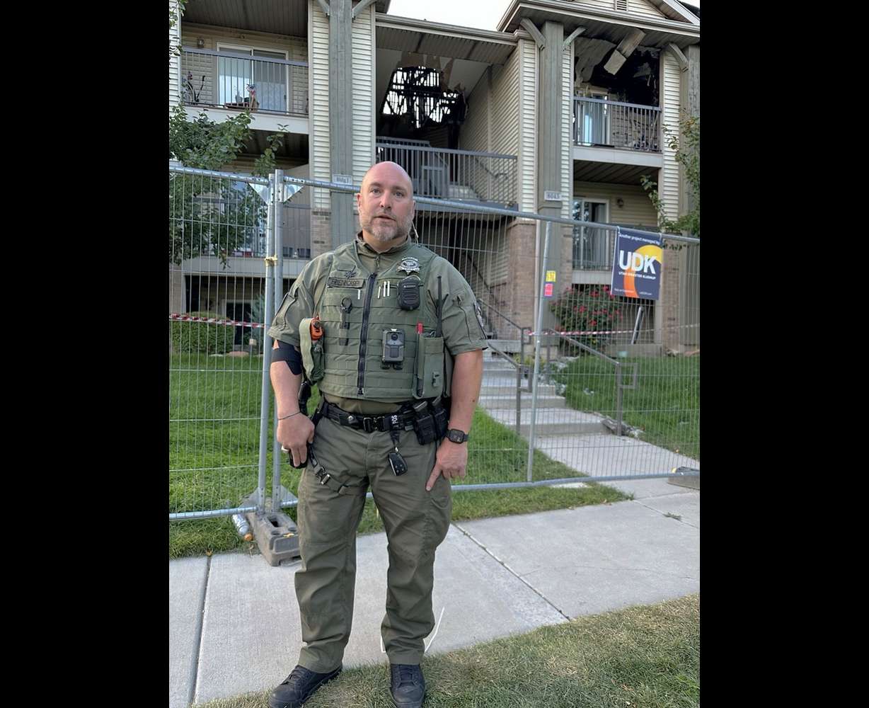 Utah County Sheriff's Sgt. Nicholas Friedrichsen is pictured Tuesday at the apartment complex damaged by fire in Eagle Mountain on Aug. 26. His body camera shows deputies risking their lives to alert residents to the fire.