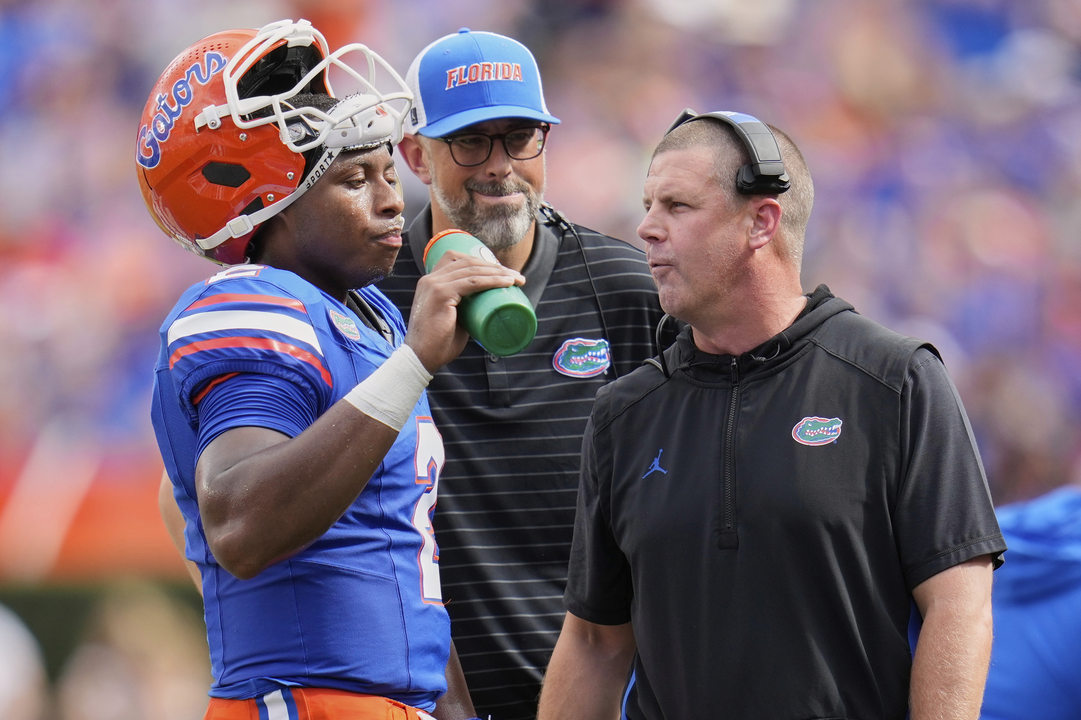 Florida head coach Billy Napier, right, talks with quarterback DJ Lagway during time out in the first half of an NCAA college football game against South Florida, Saturday, Sept. 6, 2025, in Gainesville, Fla. 