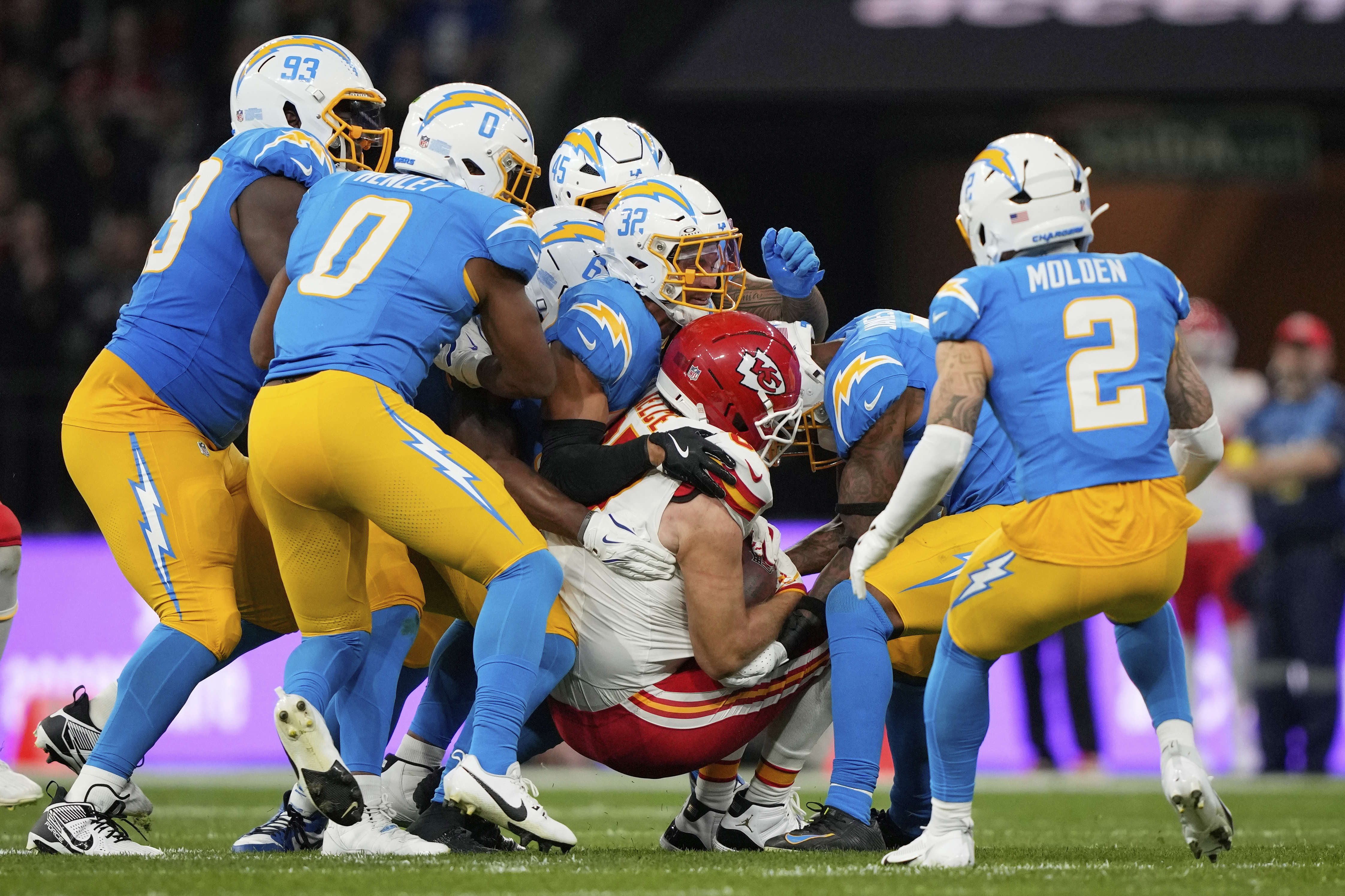 Kansas City Chiefs tight end Travis Kelce is tackled by the Los Angeles Chargers during the first half of an NFL football game, Friday, Sept. 5, 2025, in Sao Paulo.