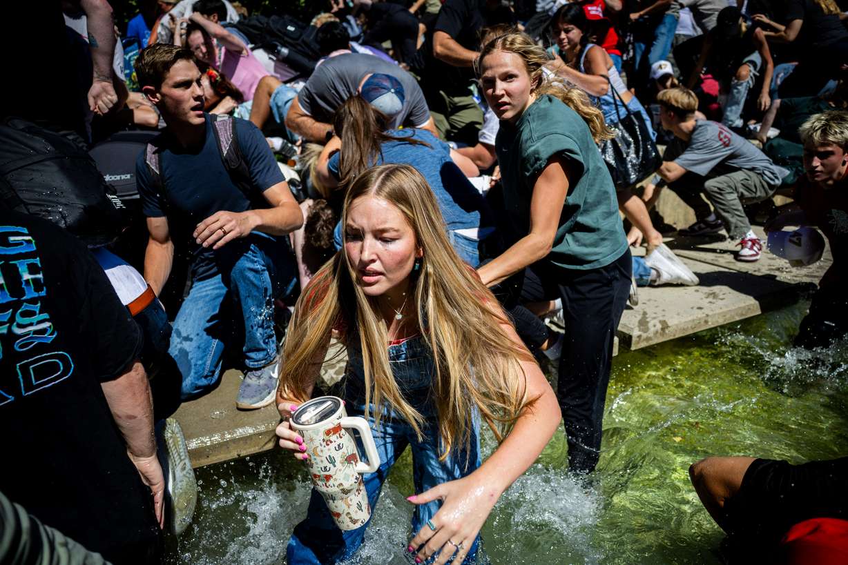 The crowd reacts after Charlie Kirk is shot during Turning Point USA’s visit to Utah Valley University in Orem on Sept. 10.