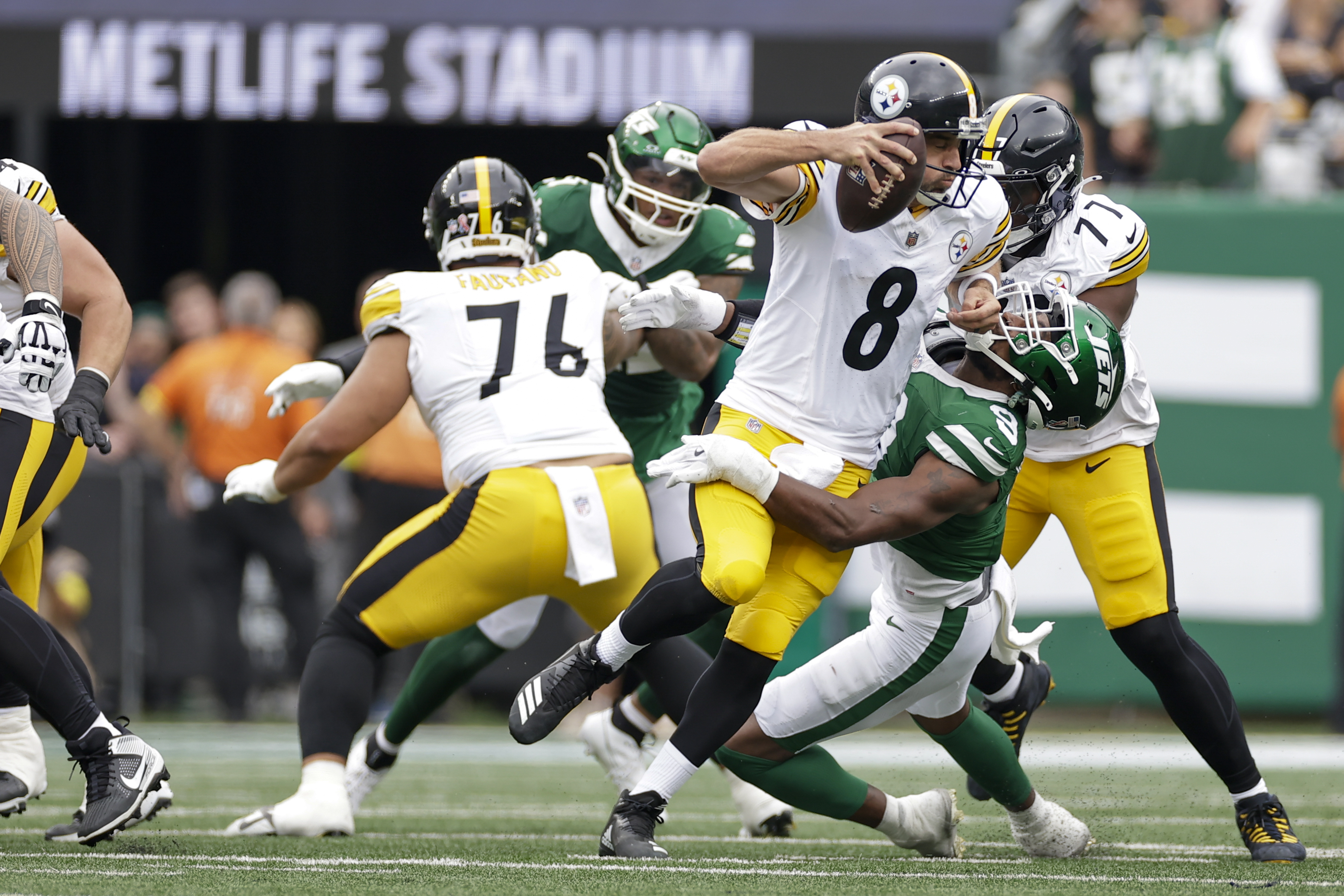 Pittsburgh Steelers quarterback Aaron Rodgers (8) is sacked by New York Jets defensive end Will McDonald IV (9) during the first half of an NFL football game Sunday, Sept. 7, 2025, in East Rutherford, N.J. 
