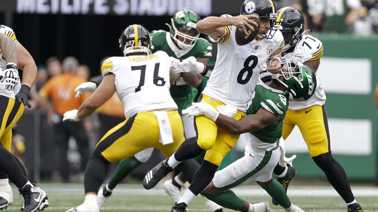 Pittsburgh Steelers quarterback Aaron Rodgers (8) is sacked by New York Jets defensive end Will McDonald IV (9) during the first half of an NFL football game Sunday, Sept. 7, 2025, in East Rutherford, N.J.