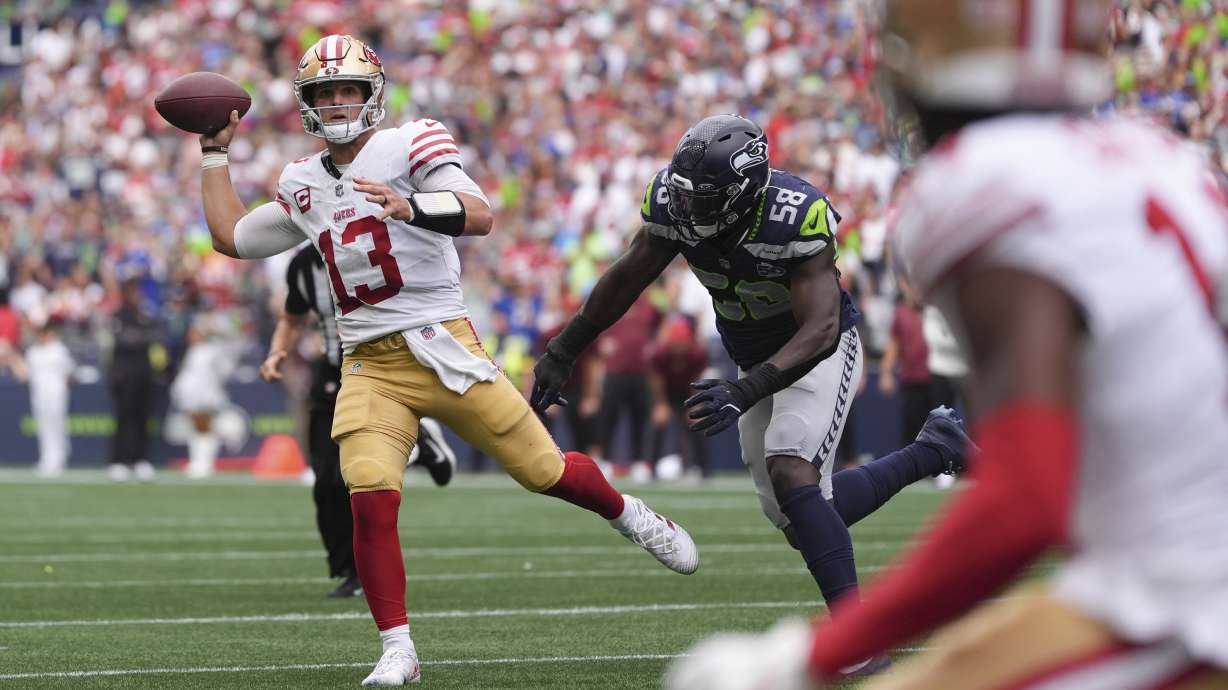 San Francisco 49ers quarterback Brock Purdy (13) throws during the second half of an NFL football game against the Seattle Seahawks, Sunday, Sept. 7, 2025, in Seattle.