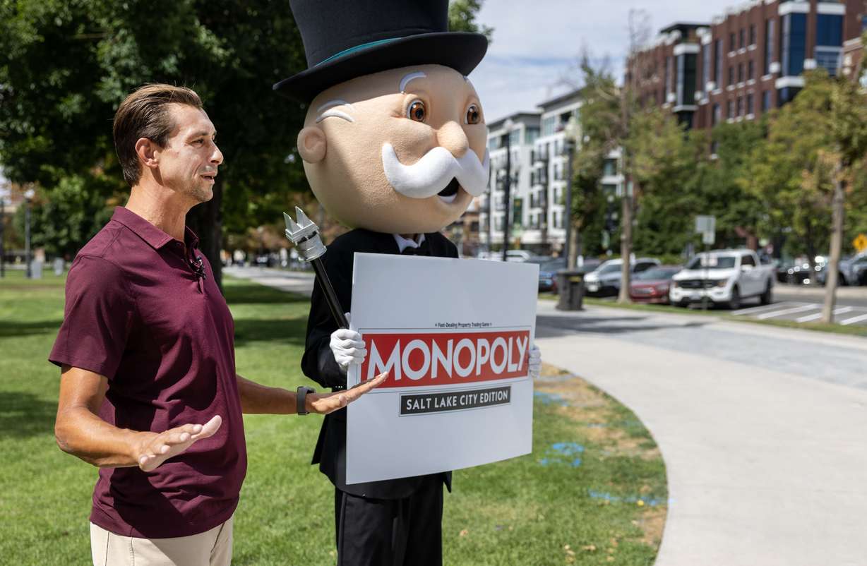 Aaron Green, a spokesperson for Top Trumps USA, and Mr. Monopoly make an announcement that a Monopoly: Salt Lake City Edition will debut in the summer of 2026 on Wednesday.