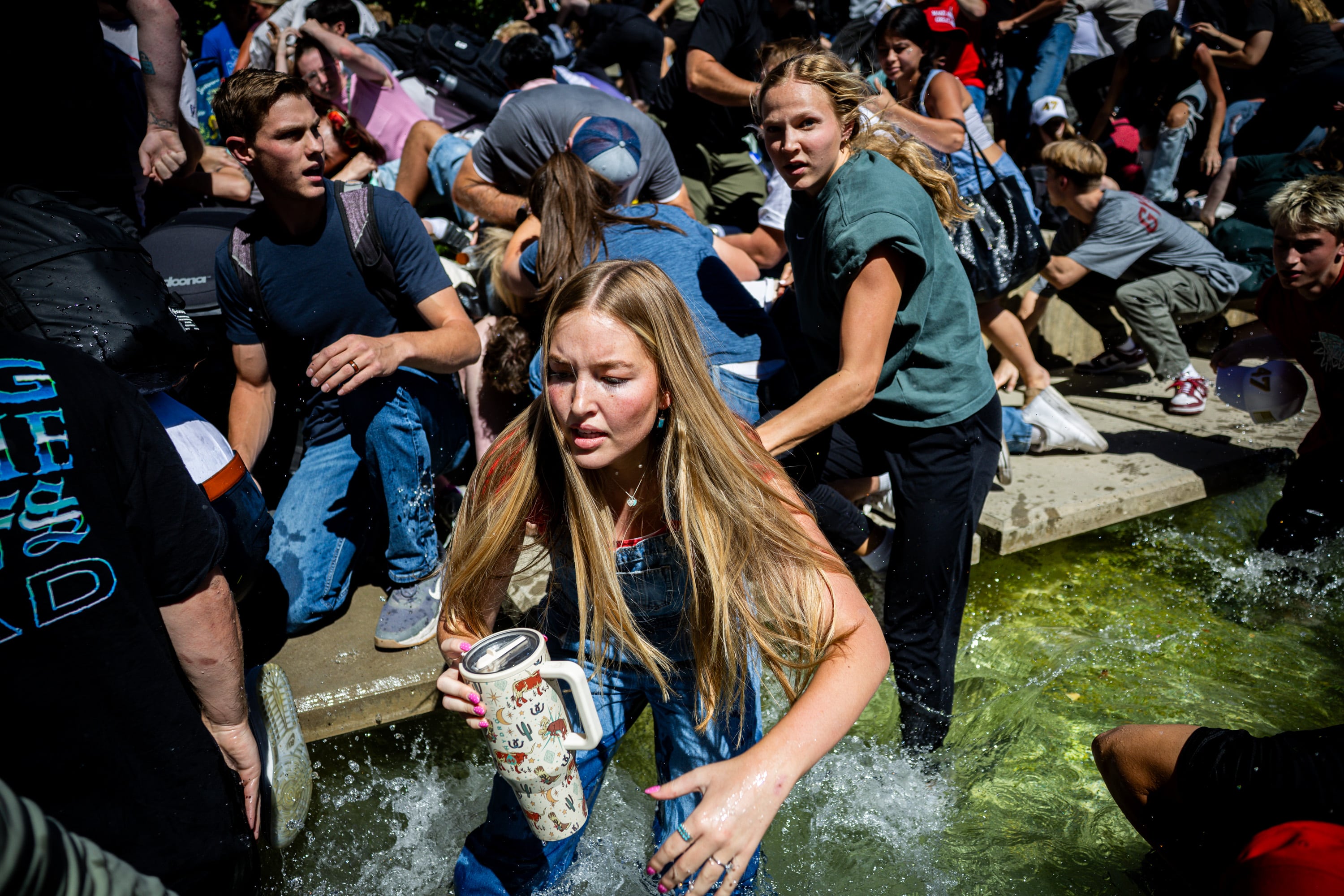 The crowd reacts after Charlie Kirk was shot during Turning Point USA’s visit to Utah Valley University in Orem on Wednesday.