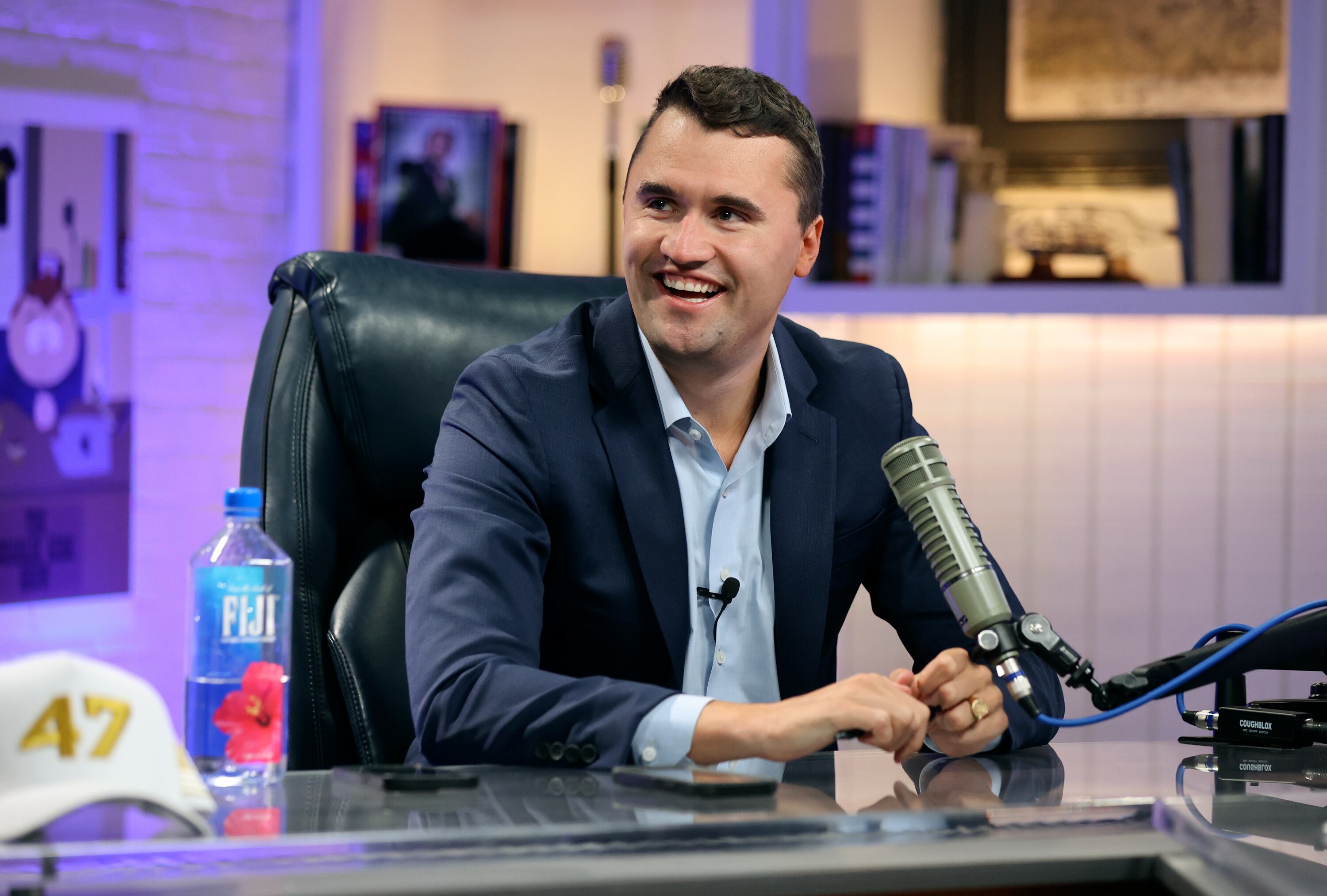 Charlie Kirk, Turning Point USA founder and president, answers interview questions on the set of The Charlie Kirk Show at Turning Point headquarters in Phoenix, Ariz., Aug. 19.
