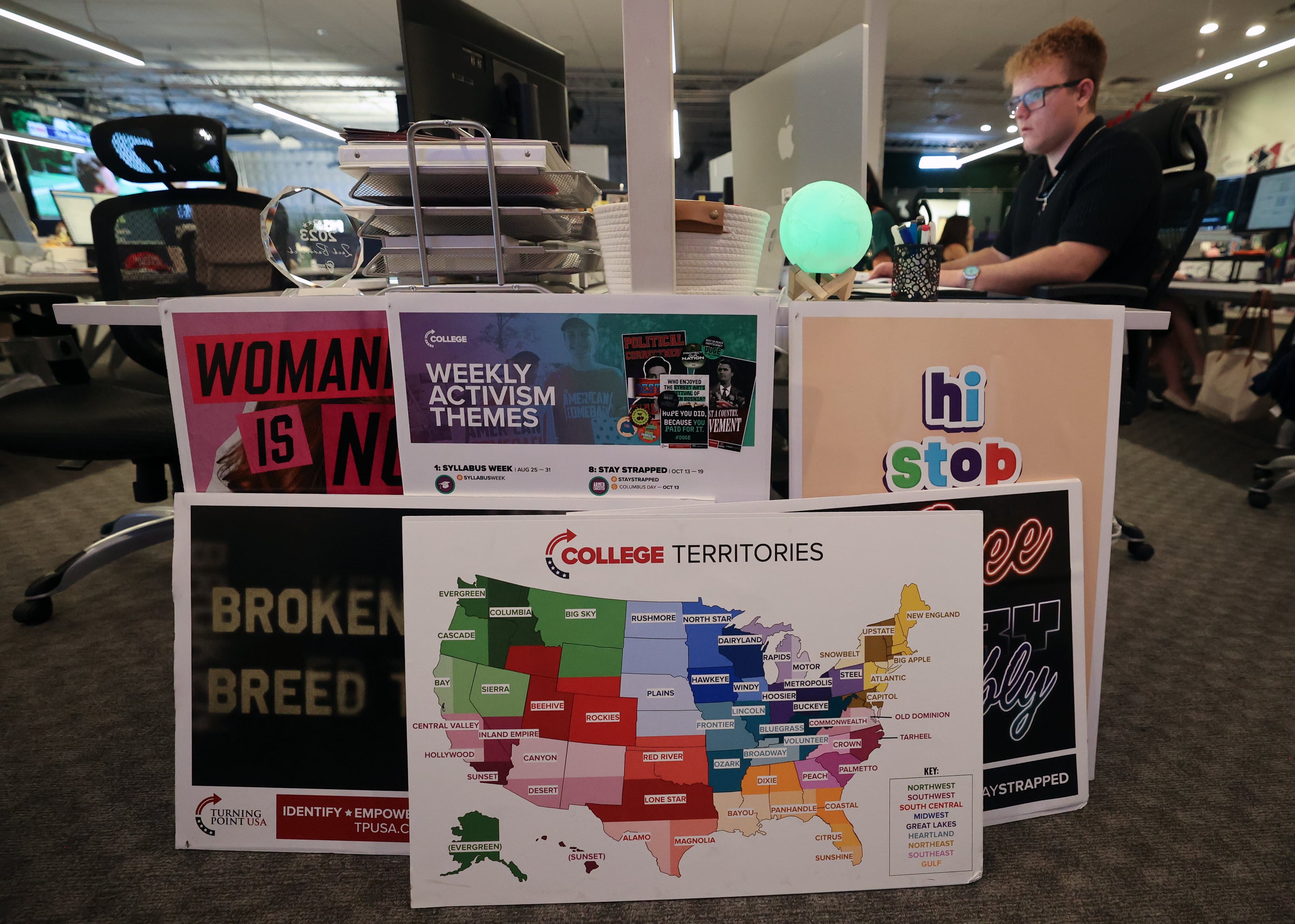 Noah Druecker, Turning Point USA College Field Program data analytics administrator, works at Turning Point headquarters in Phoenix, Ariz., on Aug. 19.