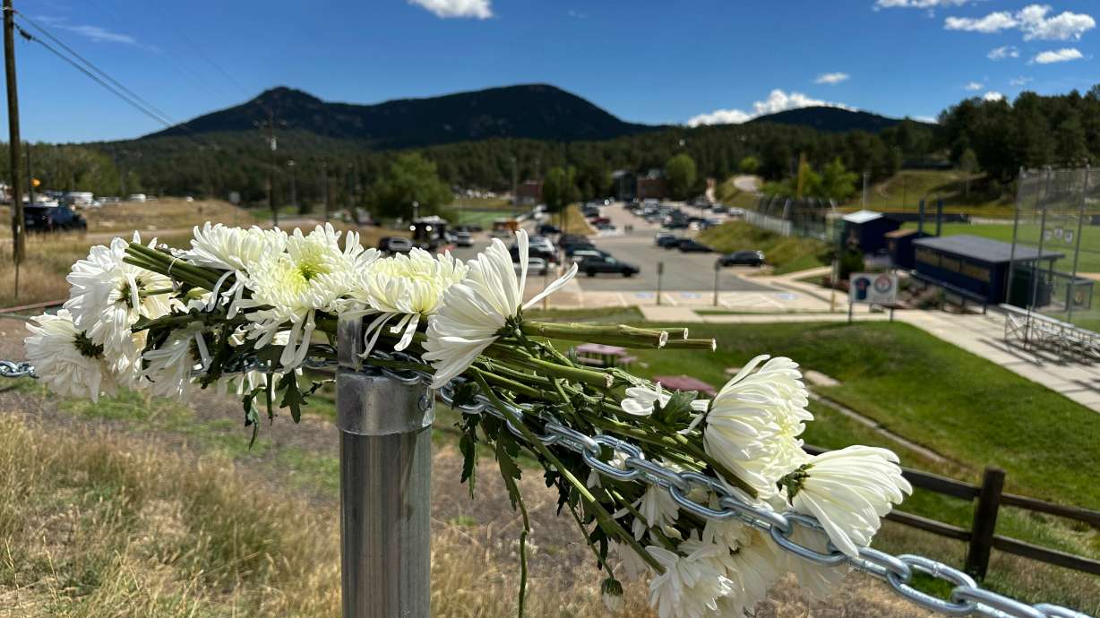 Flowers in remembrance of those wounded in a shooting at Evergreen High School in Evergreen, Colo., Thursday. Authorities said a 16-year-old radicalized by an unspecified "extremist network" fired a revolver multiple times during the attack.