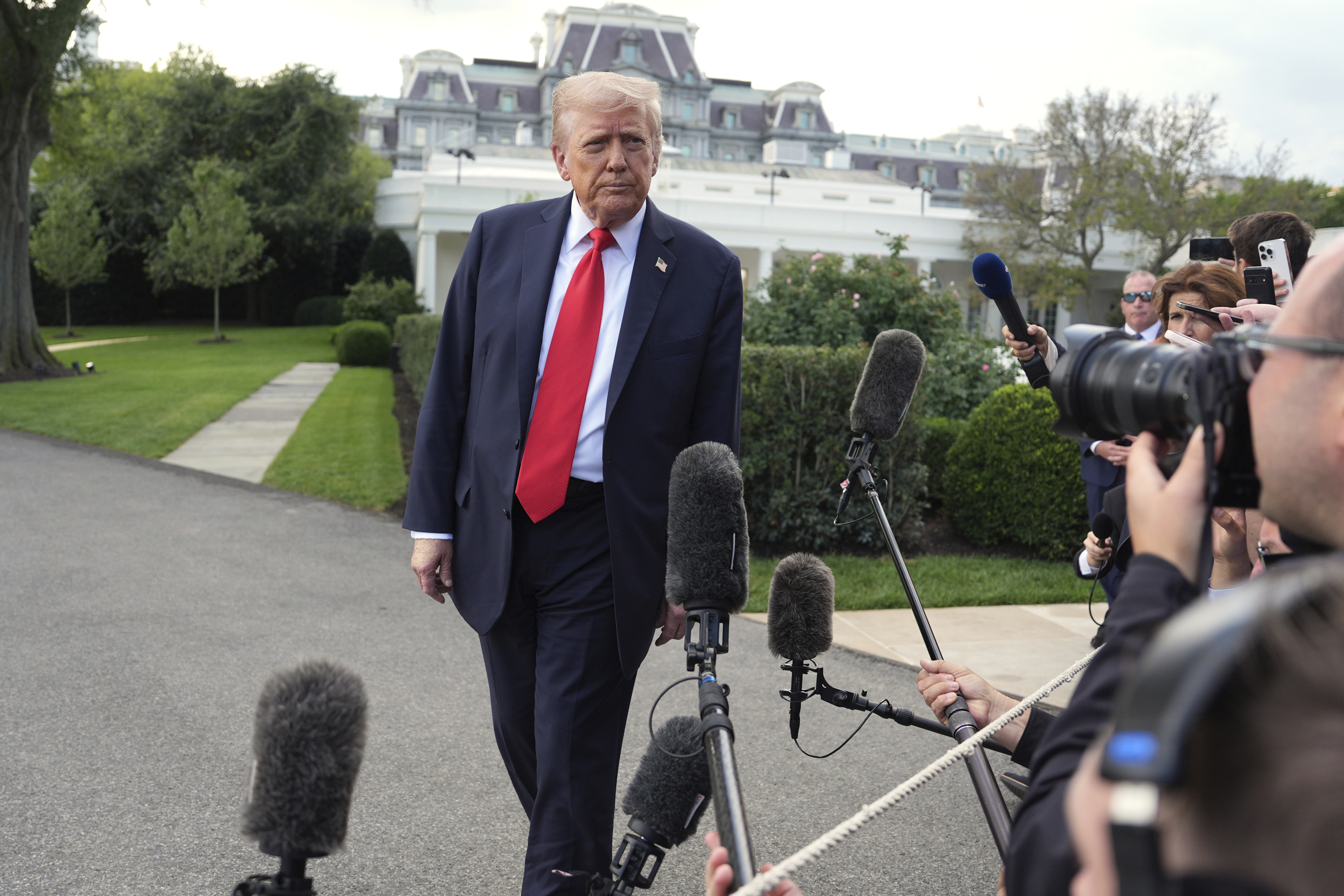 President Donald Trump speaks with reporters before boarding Marine One on the South Lawn of the White House, Thursday, Sept. 11, 2025, in Washington. 