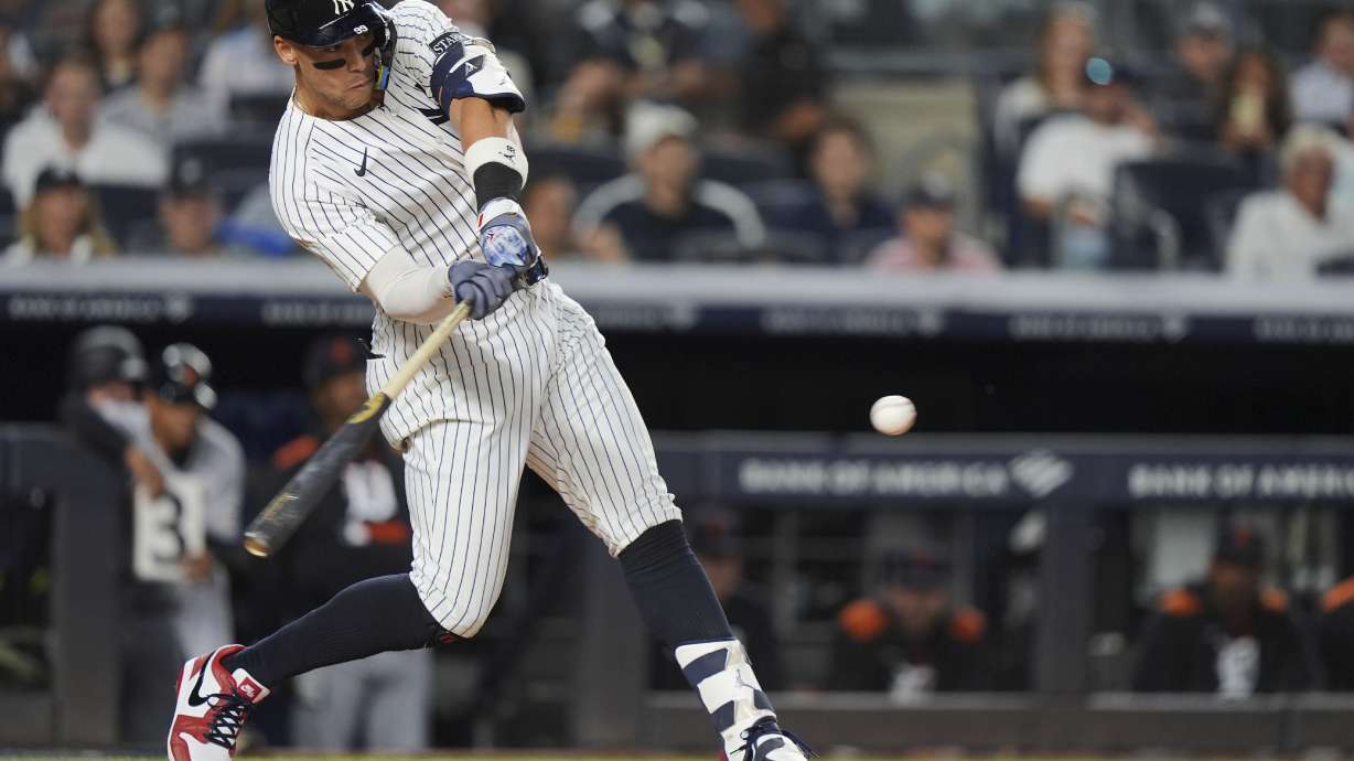 New York Yankees' Aaron Judge hits a home run during the first inning of a baseball game against the Detroit Tigers Thursday, Sept. 11, 2025, in New York.