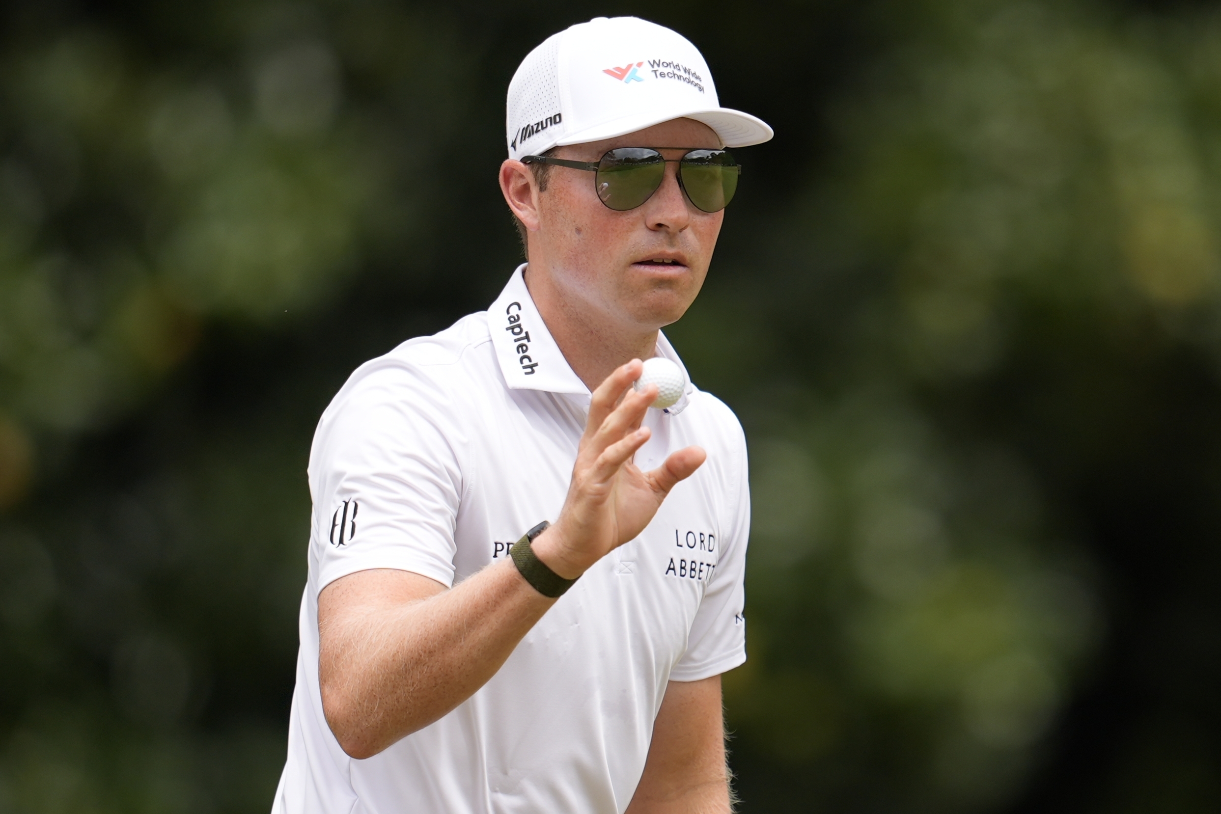 Ben Griffin waves to spectaots on the second green during the third round of the Tour Championship golf tournament, Saturday, Aug. 23, 2025, in Atlanta. 