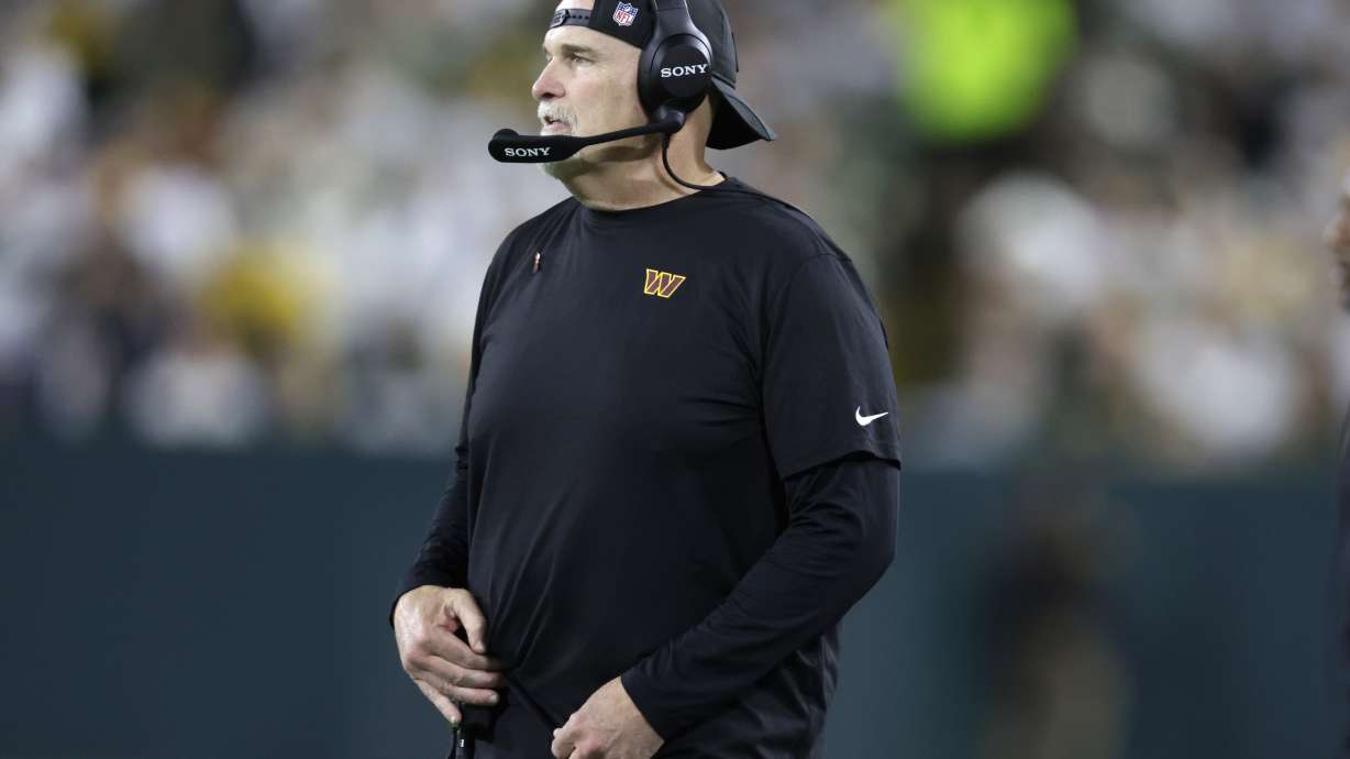 Washington Commanders head coach Dan Quinn watches from the sidelines during the second half of an NFL football game against the Green Bay Packers Thursday, Sept. 11, 2025, in Green Bay, Wis.