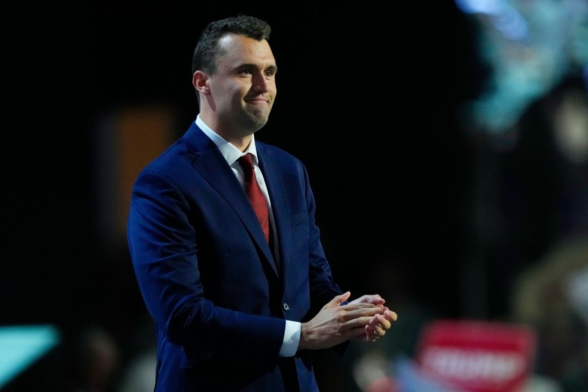 Charlie Kirk, co-founder of Turning Point USA, stands during microphone check before the start of the first day of the Republican National Convention, July 15, 2024, in Milwaukee. 