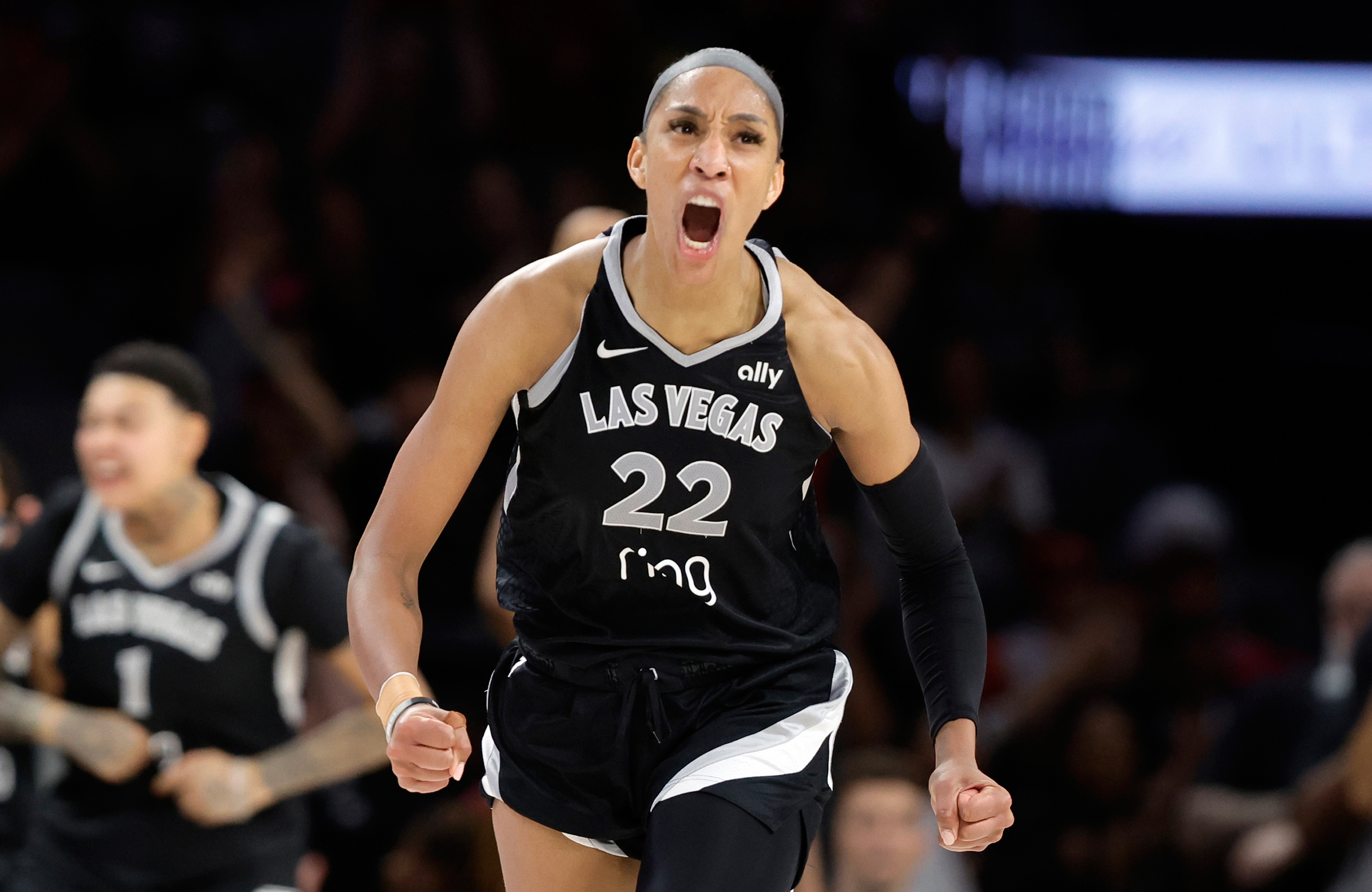 FILE - Las Vegas Aces center A'ja Wilson (22) celebrates after making a basket against the Atlanta Dream during the second half of a WNBA basketball game Tuesday, Aug. 19, 2025, in Las Vegas. 
