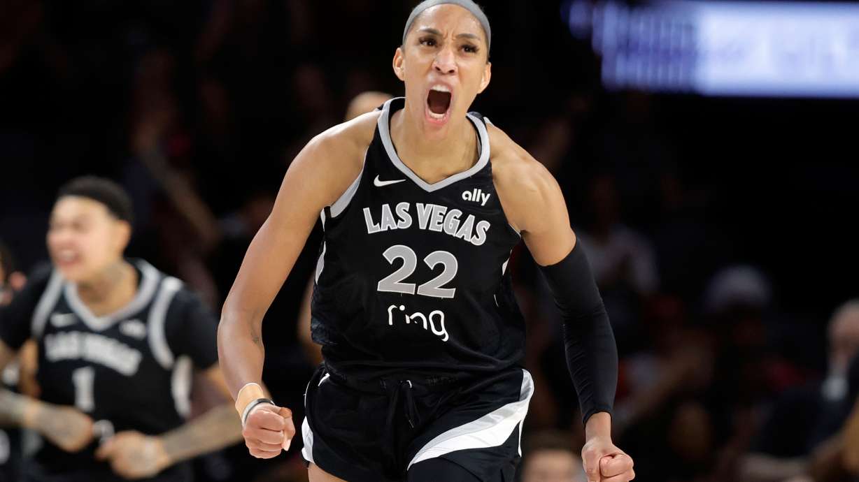 FILE - Las Vegas Aces center A'ja Wilson (22) celebrates after making a basket against the Atlanta Dream during the second half of a WNBA basketball game Tuesday, Aug. 19, 2025, in Las Vegas.