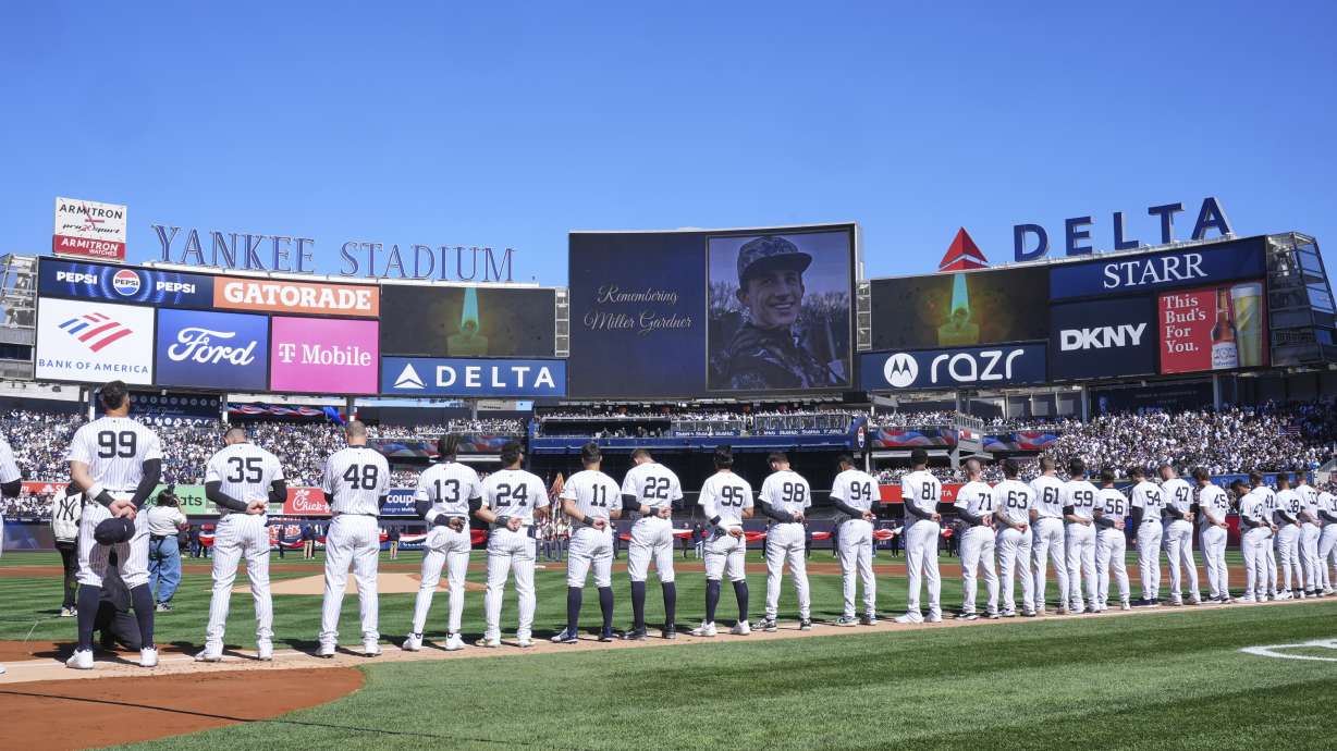 FILE - A moment of silence is observed for Miller Gardner, son of former New York Yankees player Brett Gardner, before the start of an opening-day baseball game between the Yankees and the Milwaukee Brewers at Yankee Stadium, March 27, 2025, in New York.