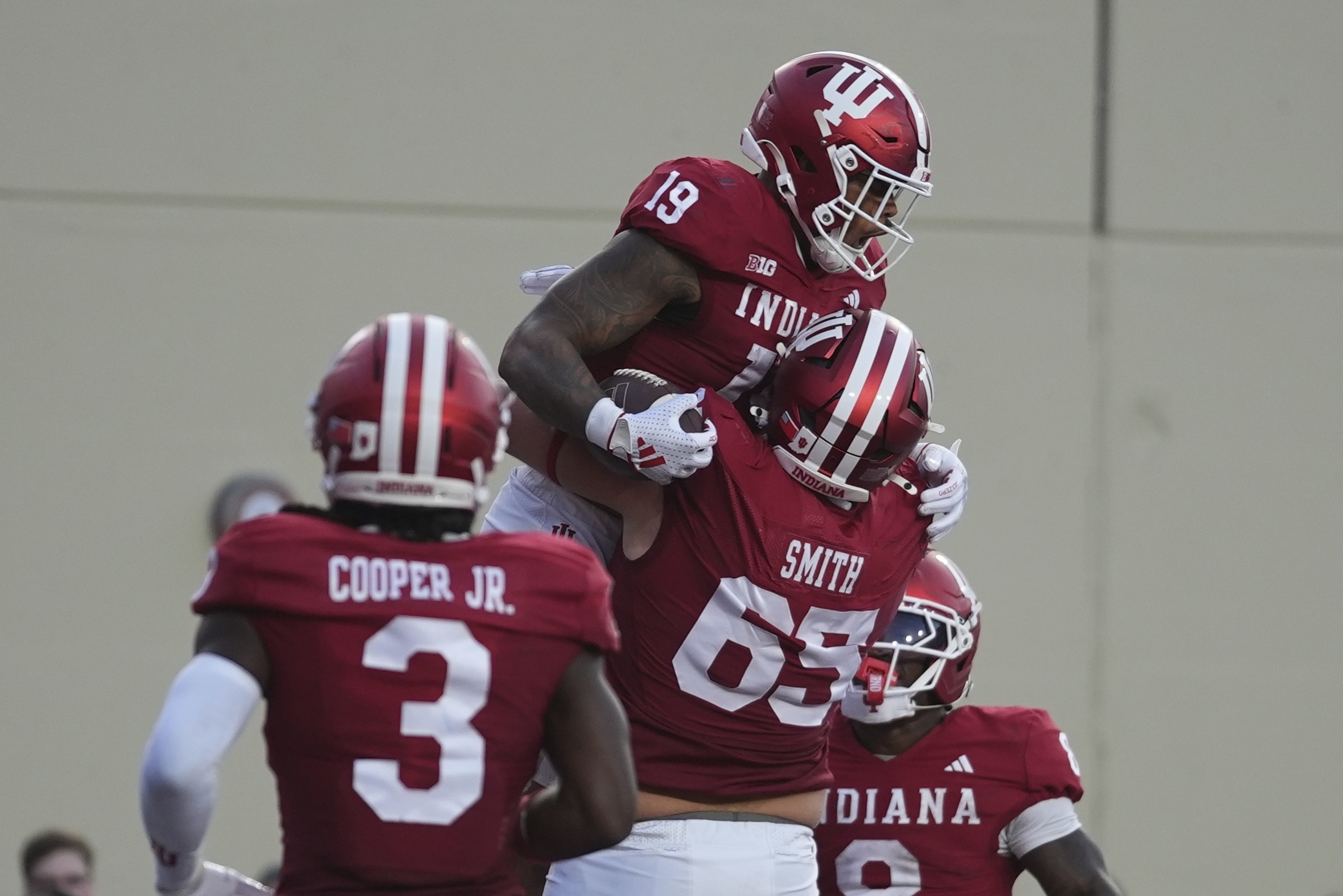Indiana tight end Holden Staes (19) celebrates a touchdown catch with offensive lineman Carter Smith during the first half of an NCAA college football game against Indiana State , Friday, Sept. 12, 2025, in Bloomington, Ind. 