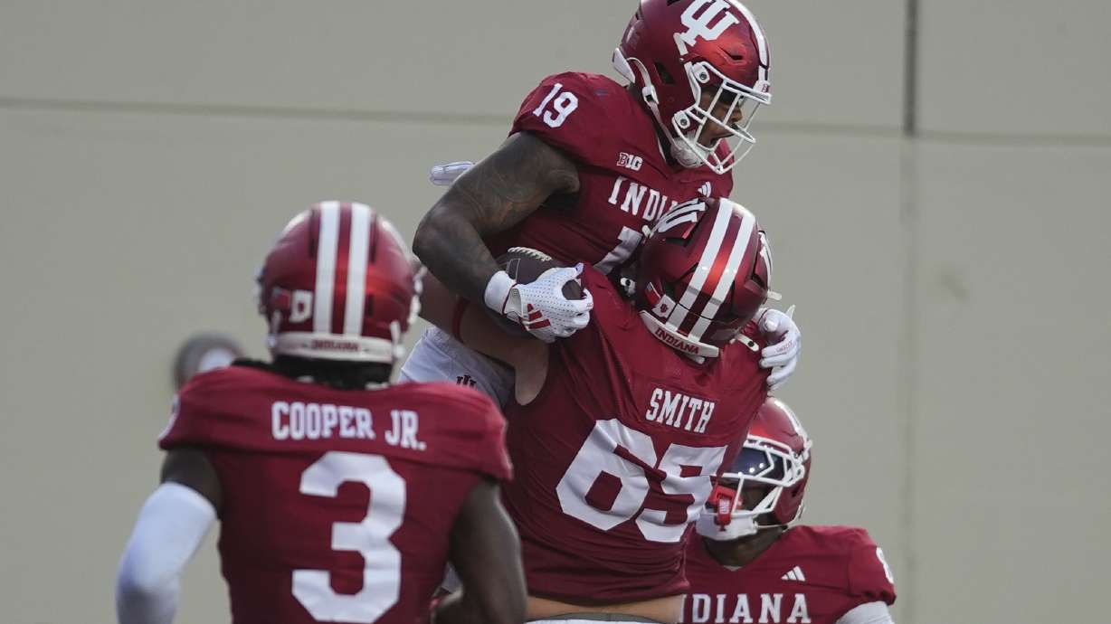 Indiana tight end Holden Staes (19) celebrates a touchdown catch with offensive lineman Carter Smith during the first half of an NCAA college football game against Indiana State , Friday, Sept. 12, 2025, in Bloomington, Ind.
