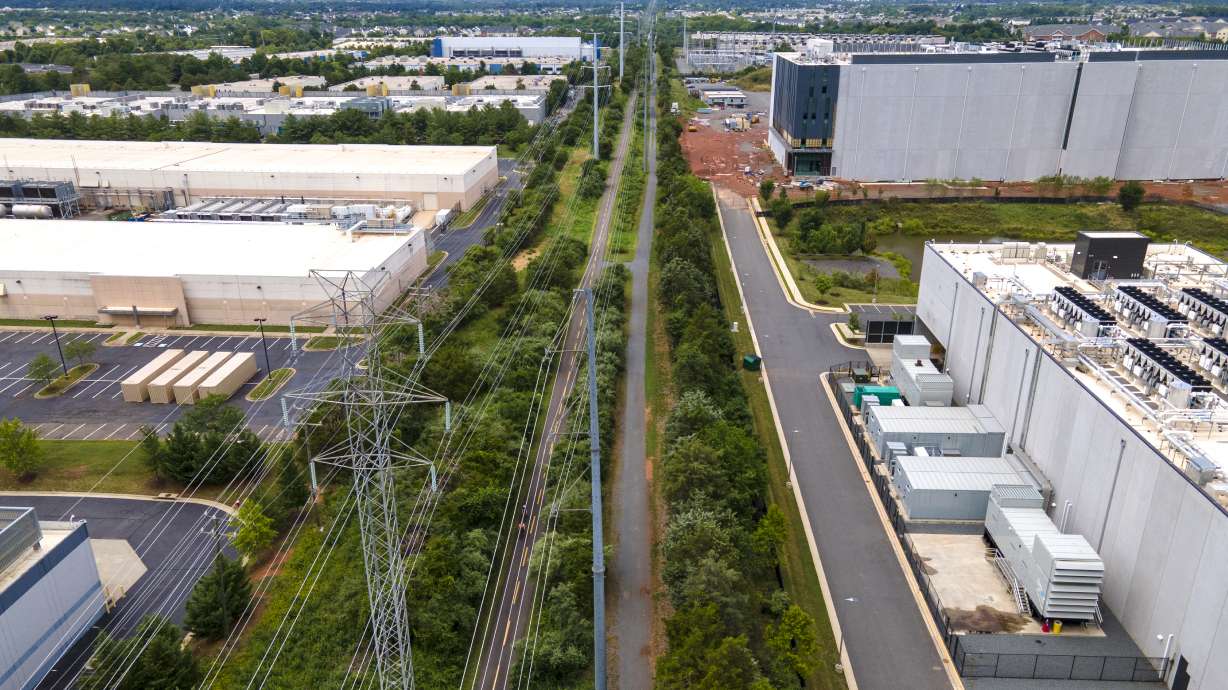 High-voltage transmission lines provide electricity to data centers in Ashburn in Loudon County, Virginia, on July 16, 2023.