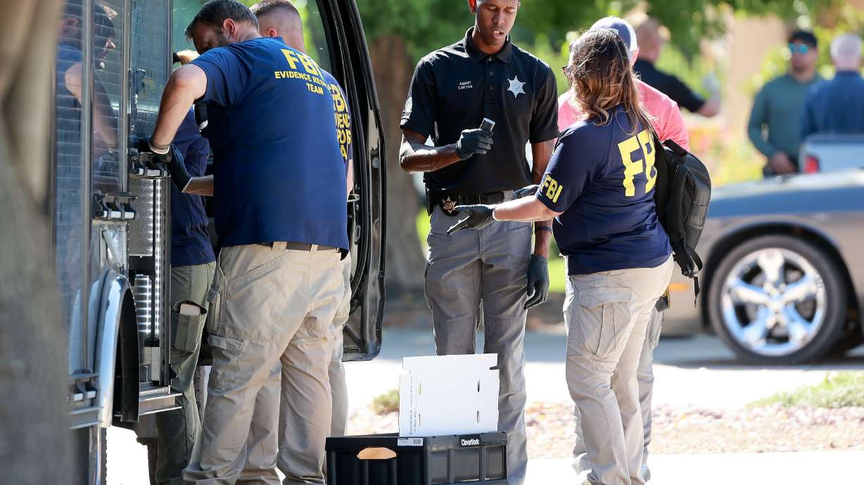 FBI, Department of Public Safety and police work at the family home of Tyler Robinson, who is the suspect in the Utah Valley University killing of Charlie Kirk, in Washington, Washington County, on Friday. Kirk was a conservative activist and the founder and president of Turning Point USA.