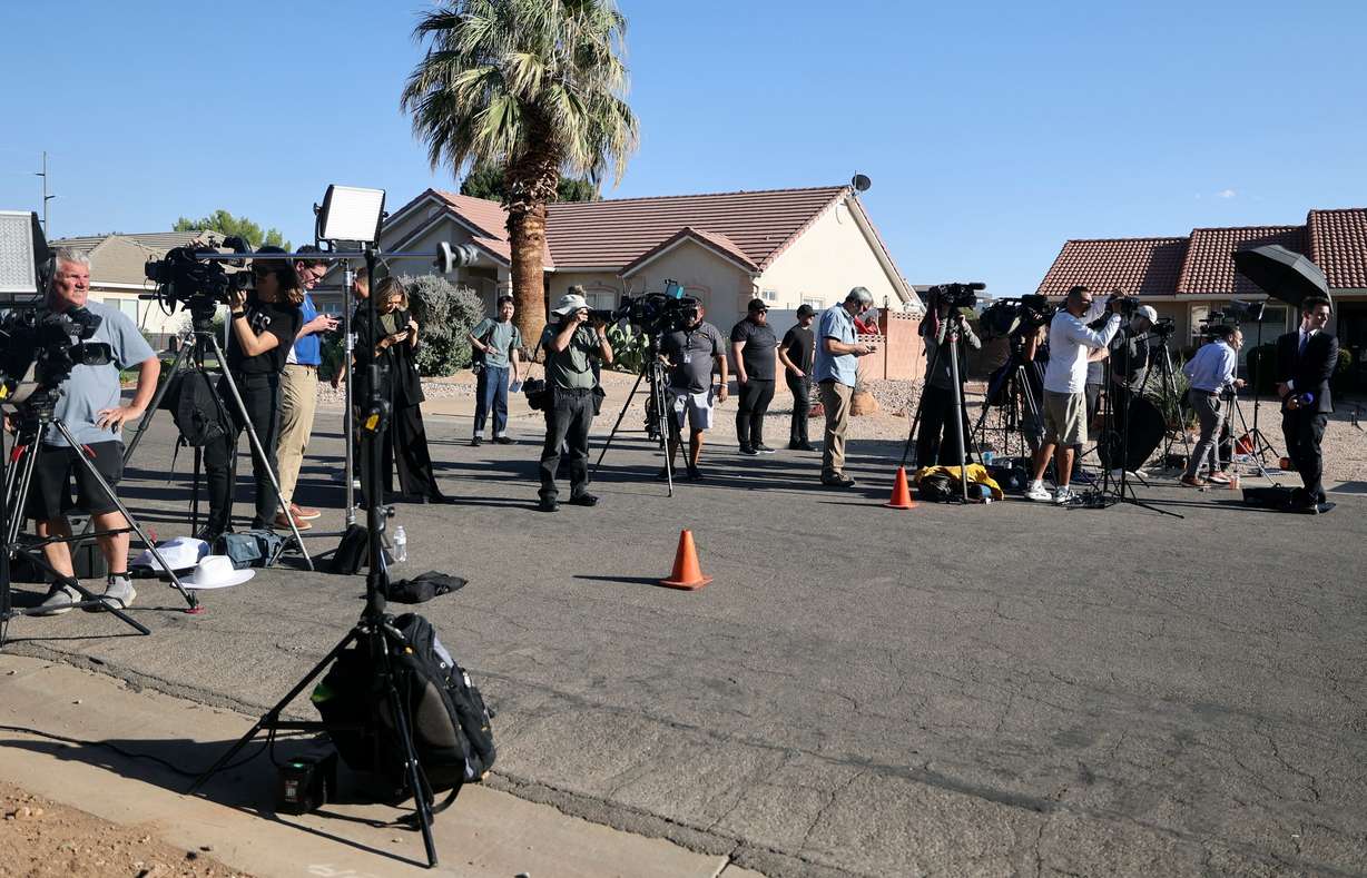 Members of the media work near the family home of Tyler Robinson, who is the suspect in the Utah Valley University killing of Charlie Kirk, in Washington, Utah, on Friday.